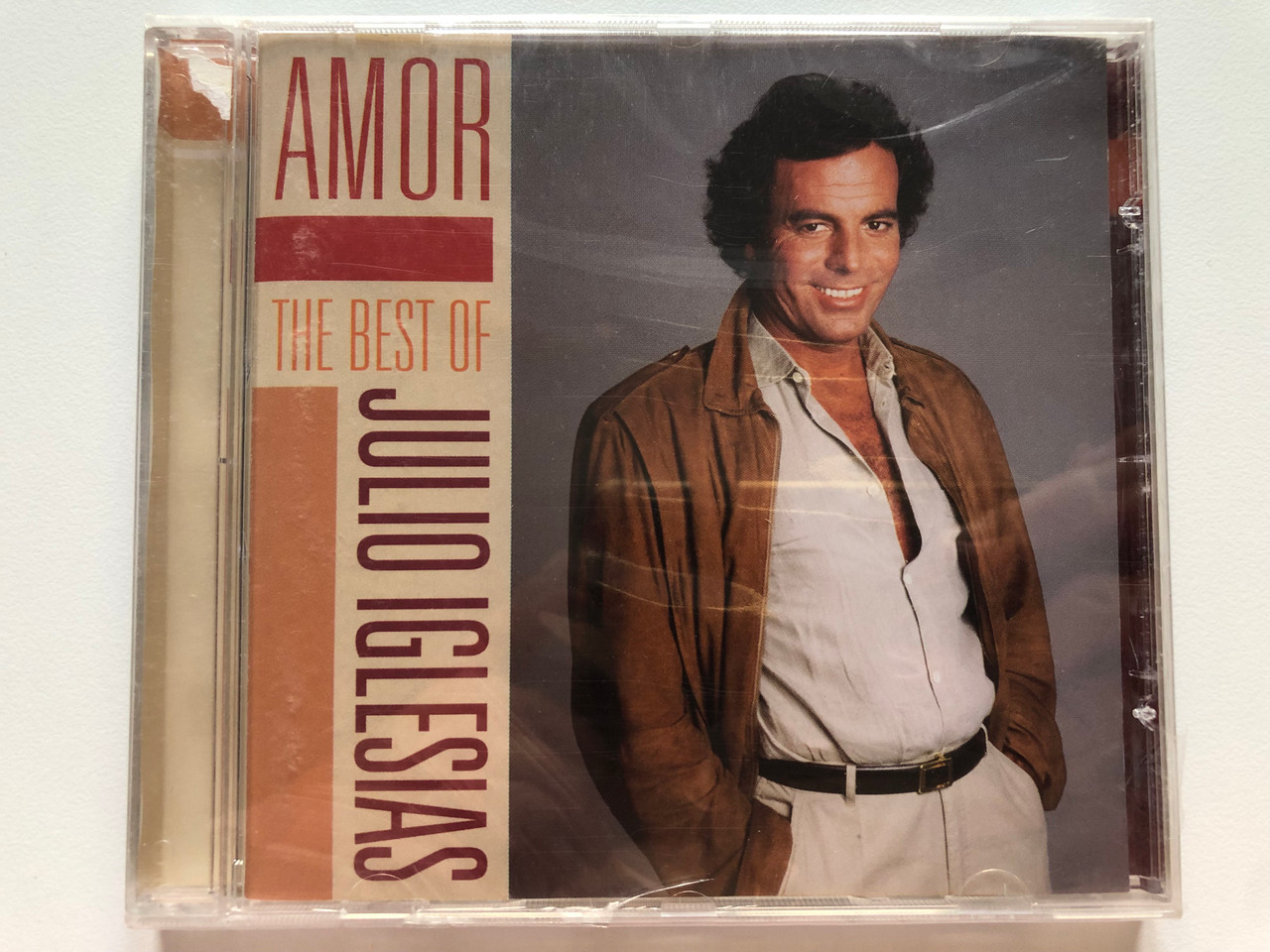 https://cdn10.bigcommerce.com/s-62bdpkt7pb/products/0/images/222900/The_Best_Of_Julio_Iglesias_-_Amor_Camden_Audio_CD_2010_88697794942_1__25879.1650389494.1280.1280.JPG?c=2&_gl=1*3p77b*_ga*MjA2NTIxMjE2MC4xNTkwNTEyNTMy*_ga_WS2VZYPC6G*MTY1MDM3NjM3NC4zNjEuMS4xNjUwMzg5NDAyLjQy