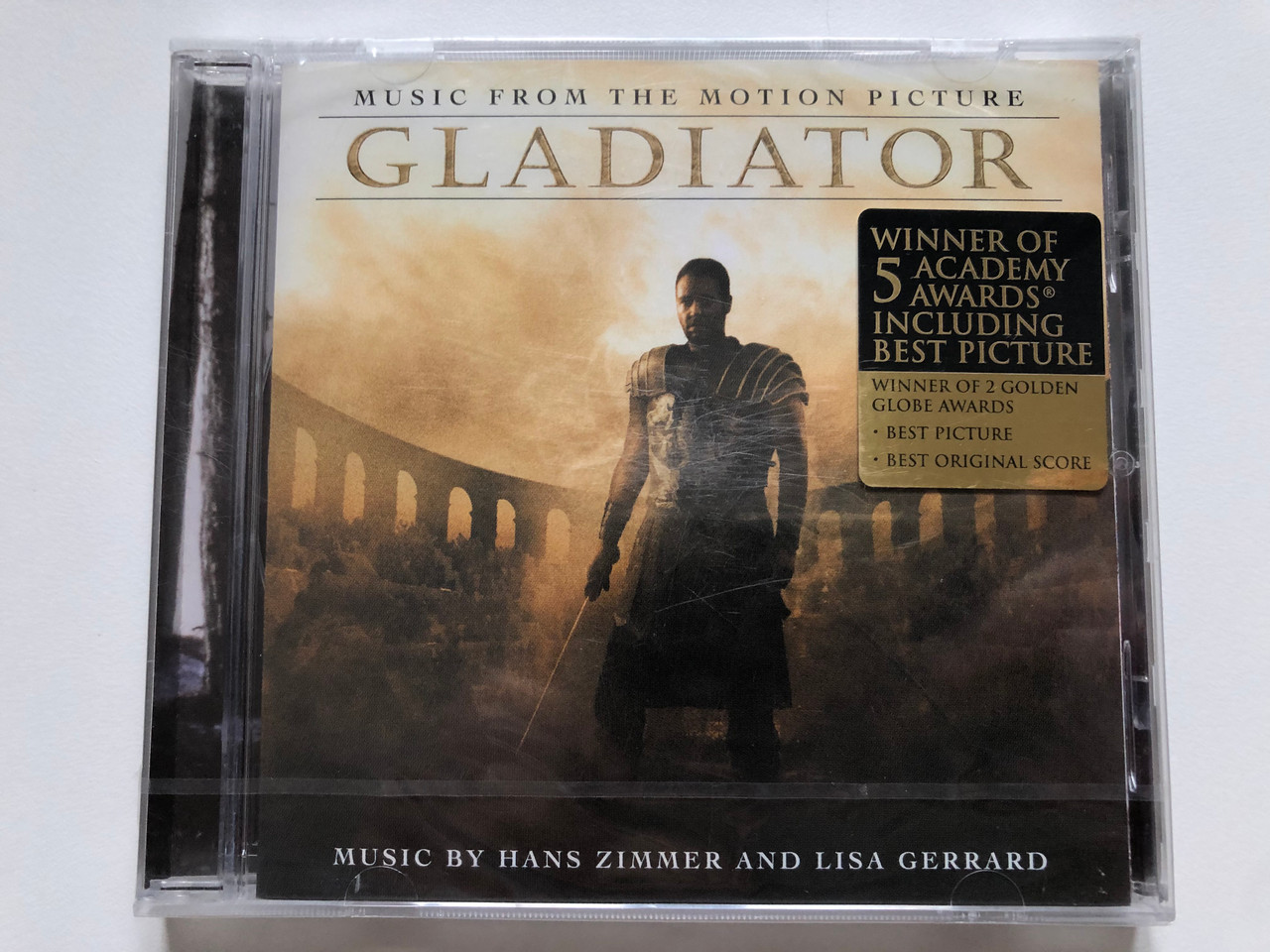 https://cdn10.bigcommerce.com/s-62bdpkt7pb/products/0/images/223163/Gladiator_Music_From_The_Motion_Picture_-_Music_By_Hans_Zimmer_And_Lisa_Gerrard_Winner_Of_5_Academy_Awards_Including_Best_Picture_Winner_Of_2_Golden_Globe_Awards_Best_Picture_Best_Origi_1__01331.1650468411.1280.1280.JPG?c=2&_gl=1*1oovhuo*_ga*MjA2NTIxMjE2MC4xNTkwNTEyNTMy*_ga_WS2VZYPC6G*MTY1MDQ2MjU1MC4zNjIuMS4xNjUwNDY4MTU4LjU2