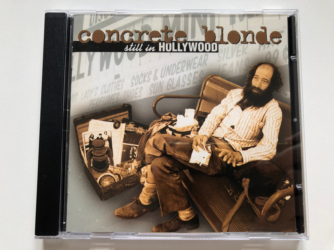 https://cdn10.bigcommerce.com/s-62bdpkt7pb/products/0/images/223561/Concrete_Blonde_Still_In_Hollywood_I.R.S._Records_Audio_CD_1994_724382912828_1__63347.1650553274.1280.1280.JPG?c=2&_gl=1*i05dze*_ga*MjA2NTIxMjE2MC4xNTkwNTEyNTMy*_ga_WS2VZYPC6G*MTY1MDU0ODUxNi4zNjQuMS4xNjUwNTUyNjQ4LjYw