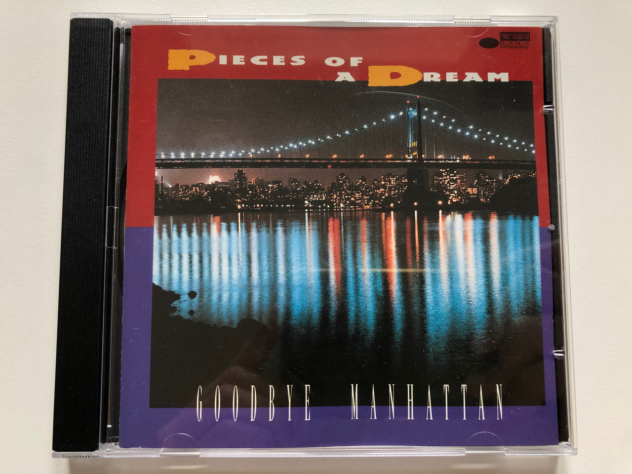 https://cdn10.bigcommerce.com/s-62bdpkt7pb/products/0/images/223603/Pieces_Of_A_Dream_Goodbye_Manhattan_Blue_Note_Contemporary_Audio_CD_1995_CDP_7243_8_28532_2_0_1__70450.1650556887.1280.1280.JPG?c=2&_gl=1*1kts3n6*_ga*MjA2NTIxMjE2MC4xNTkwNTEyNTMy*_ga_WS2VZYPC6G*MTY1MDU0ODUxNi4zNjQuMS4xNjUwNTU2ODgxLjYw