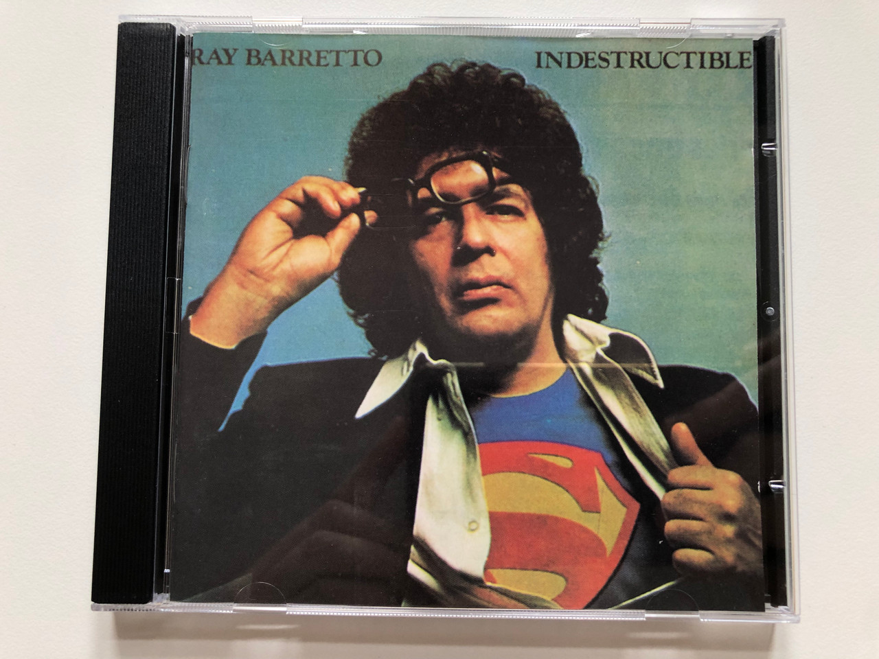 https://cdn10.bigcommerce.com/s-62bdpkt7pb/products/0/images/223617/Ray_Barretto_Indestructible_Third_Audio_CD_1991_33312_1__10079.1650557473.1280.1280.JPG?c=2&_gl=1*lbhxk3*_ga*MjA2NTIxMjE2MC4xNTkwNTEyNTMy*_ga_WS2VZYPC6G*MTY1MDU0ODUxNi4zNjQuMS4xNjUwNTU3NDcxLjYw