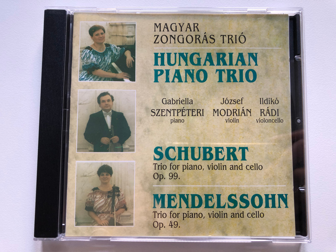 https://cdn10.bigcommerce.com/s-62bdpkt7pb/products/0/images/224650/Hungarian_Piano_Trio_-_Schubert_Trio_for_piano_violin_and_cello_Op._99_Mendelssohn_Trio_for_piano_violin_and_cello_Op._49_Gabriella_Szentpeteri_piano_Jozsef_Modrian_violin_Ildiko_Ra_1__13864.1650898127.1280.1280.JPG?c=2&_gl=1*1bnvfbx*_ga*MjA2NTIxMjE2MC4xNTkwNTEyNTMy*_ga_WS2VZYPC6G*MTY1MDg5NTU0Ni4zNjguMS4xNjUwODk3MzEzLjQ2