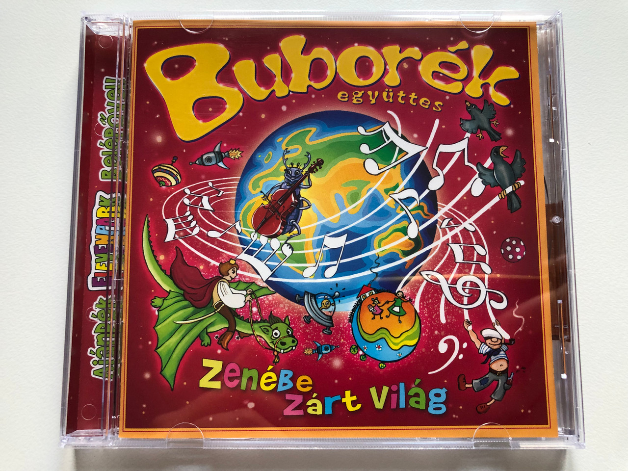 https://cdn10.bigcommerce.com/s-62bdpkt7pb/products/0/images/224719/Buborek_egyuttes_-_Zenebe_Zart_Vilag_EMI_Audio_CD_2011_098214_2_1__72710.1650954358.1280.1280.JPG?c=2&_gl=1*18q1jrc*_ga*MjA2NTIxMjE2MC4xNTkwNTEyNTMy*_ga_WS2VZYPC6G*MTY1MDk1MTExOC4zNjkuMS4xNjUwOTU0MTg5LjQz