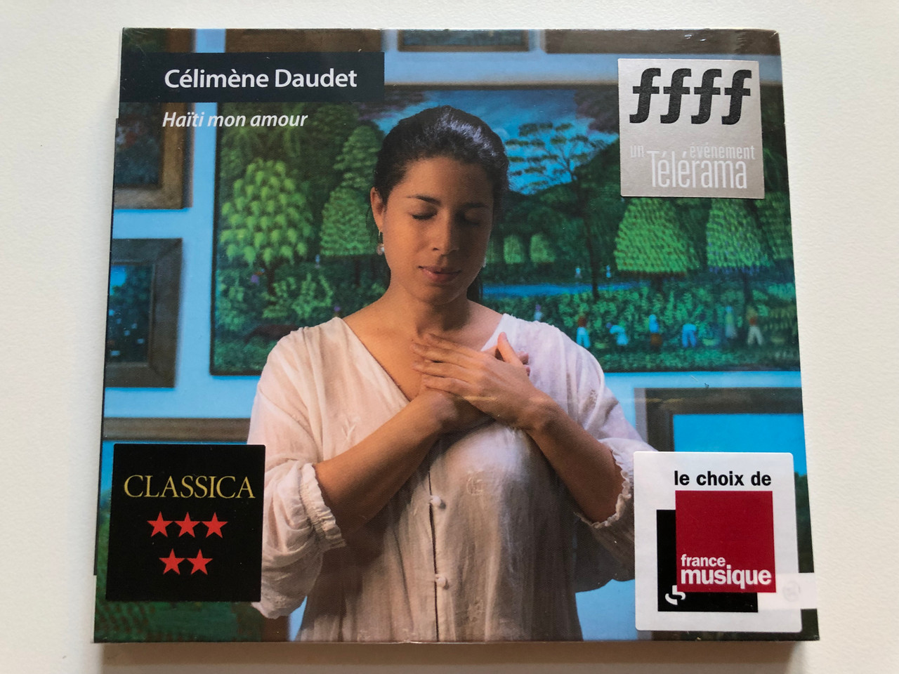 https://cdn10.bigcommerce.com/s-62bdpkt7pb/products/0/images/224975/Celimene_Daudet_-_Haiti_mon_amour_No_Mad_Music_Audio_CD_2021_NMM087_1__82652.1651041771.1280.1280.JPG?c=2&_gl=1*1j6sgsk*_ga*MjA2NTIxMjE2MC4xNTkwNTEyNTMy*_ga_WS2VZYPC6G*MTY1MTA0MDU2Mi4zNzAuMS4xNjUxMDQxODAxLjYw