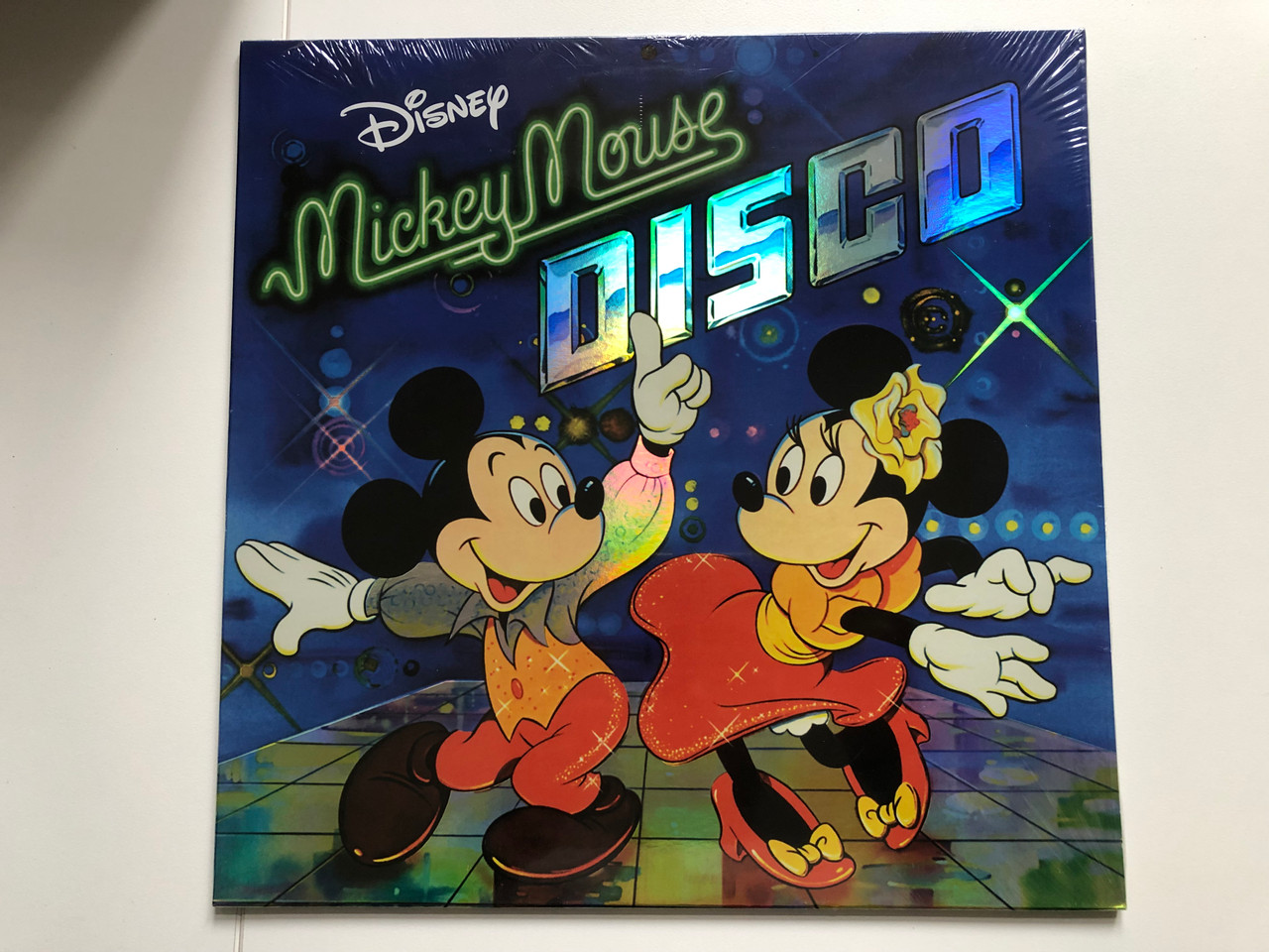 https://cdn10.bigcommerce.com/s-62bdpkt7pb/products/0/images/225356/Mickey_Mouse_Disco_Walt_Disney_Records_LP_2019_050087401047_1__32211.1651125331.1280.1280.JPG?c=2&_gl=1*1m6usca*_ga*MjA2NTIxMjE2MC4xNTkwNTEyNTMy*_ga_WS2VZYPC6G*MTY1MTEyMzM2NC4zNzIuMS4xNjUxMTI1MjMwLjQ1