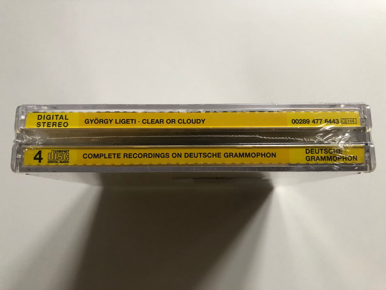https://cdn10.bigcommerce.com/s-62bdpkt7pb/products/0/images/225425/Gyrgy_Ligeti_Clear_Or_Cloudy_-_Complete_Recordings_On_Deutsche_Grammophon_Deutsche_Grammophon_4x_Audio_CD_2006_Stereo_00289_477_6443_3__14834.1651136898.1280.1280.JPG?c=2&_gl=1*1xyq62c*_ga*MjA2NTIxMjE2MC4xNTkwNTEyNTMy*_ga_WS2VZYPC6G*MTY1MTEyMzM2NC4zNzIuMS4xNjUxMTM2NjYzLjM2