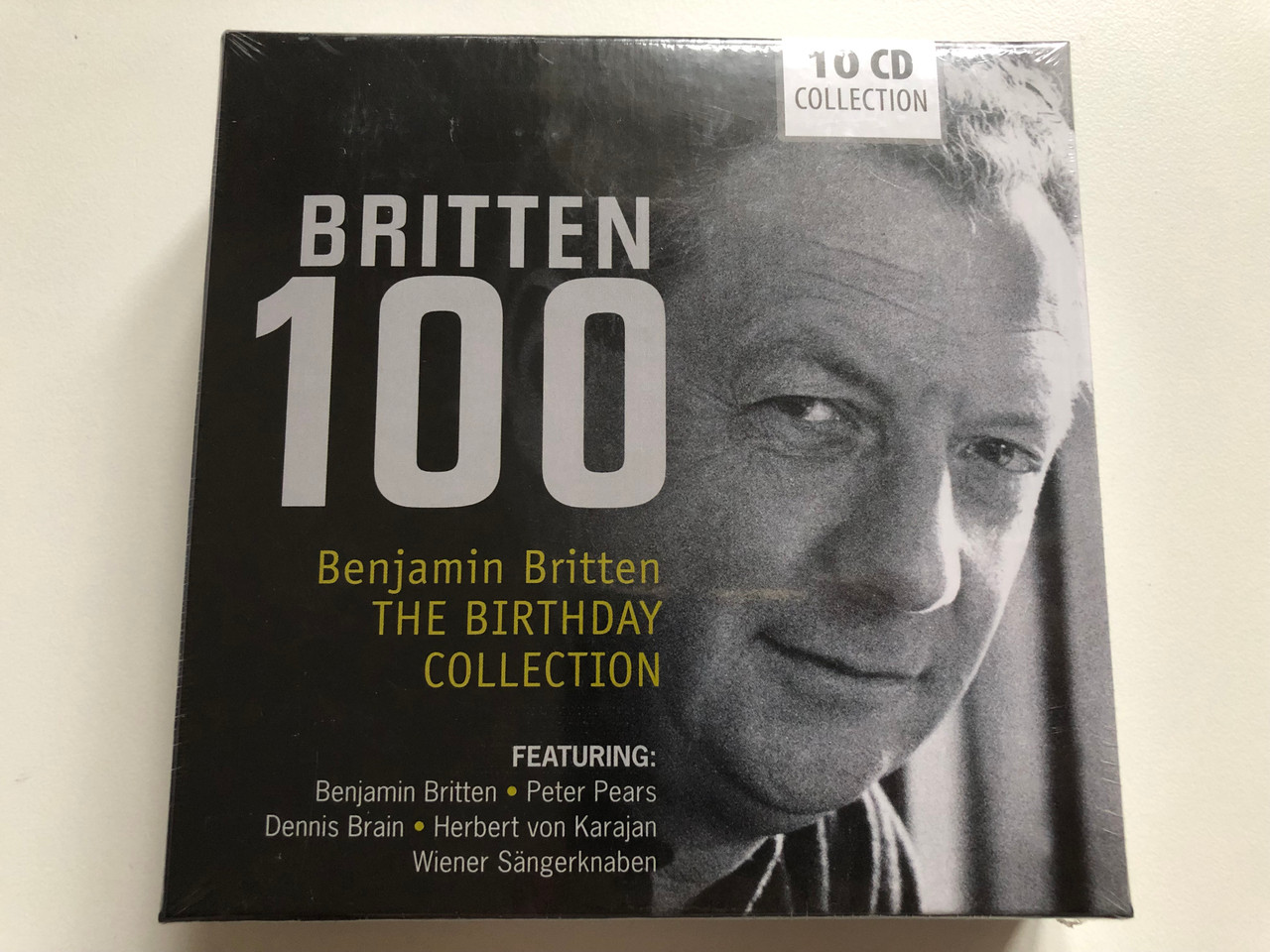 https://cdn10.bigcommerce.com/s-62bdpkt7pb/products/0/images/225887/Britten_100_Benjamin_Britten_-_The_Birthday_Collection_Featuring_Benjamin_Britten_Peter_Pears_Dennis_Brain_Herbert_von_Karajan_Wiener_Sangerknaben_Documents_10x_Audio_CD_Stereo_600047_1__98709.1651206940.1280.1280.JPG?c=2&_gl=1*gakeny*_ga*MjA2NTIxMjE2MC4xNTkwNTEyNTMy*_ga_WS2VZYPC6G*MTY1MTIwNjM2MC4zNzMuMS4xNjUxMjA2NzU4LjMx