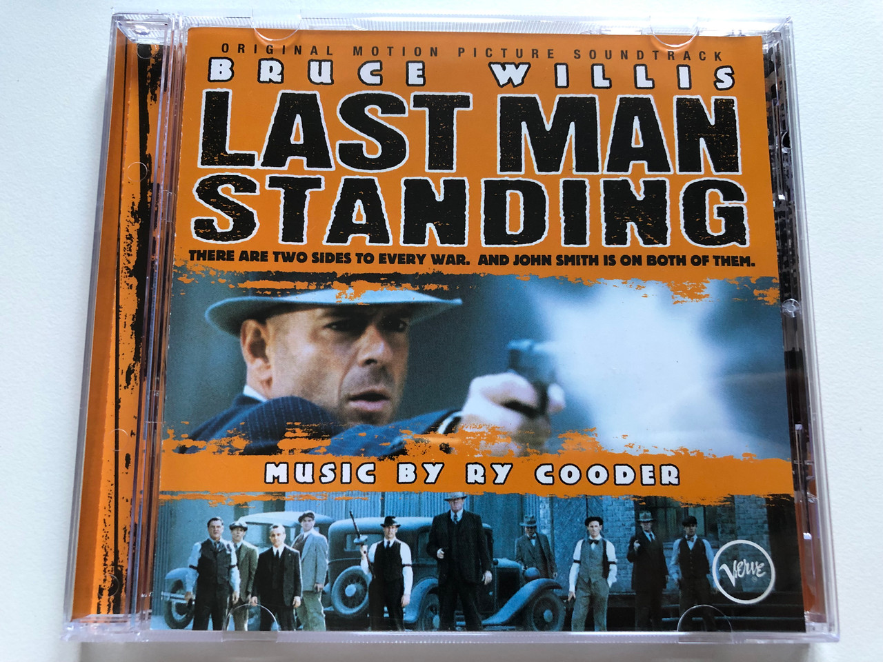 https://cdn10.bigcommerce.com/s-62bdpkt7pb/products/0/images/226434/Bruce_Willis_-_Last_Man_Standing_-_Music_By_Ry_Cooder_Original_Motion_Picture_Soundtrack_There_Are_Two_Sides_To_Every_War._And_John_Smith_Is_On_Both_Of_Them._Verve_Records_Audio_CD_1996_1__02863.1651570917.1280.1280.JPG?c=2&_gl=1*1ryffsj*_ga*MjA2NTIxMjE2MC4xNTkwNTEyNTMy*_ga_WS2VZYPC6G*MTY1MTU1ODAzOC4zODAuMS4xNjUxNTcwNzA0LjM3