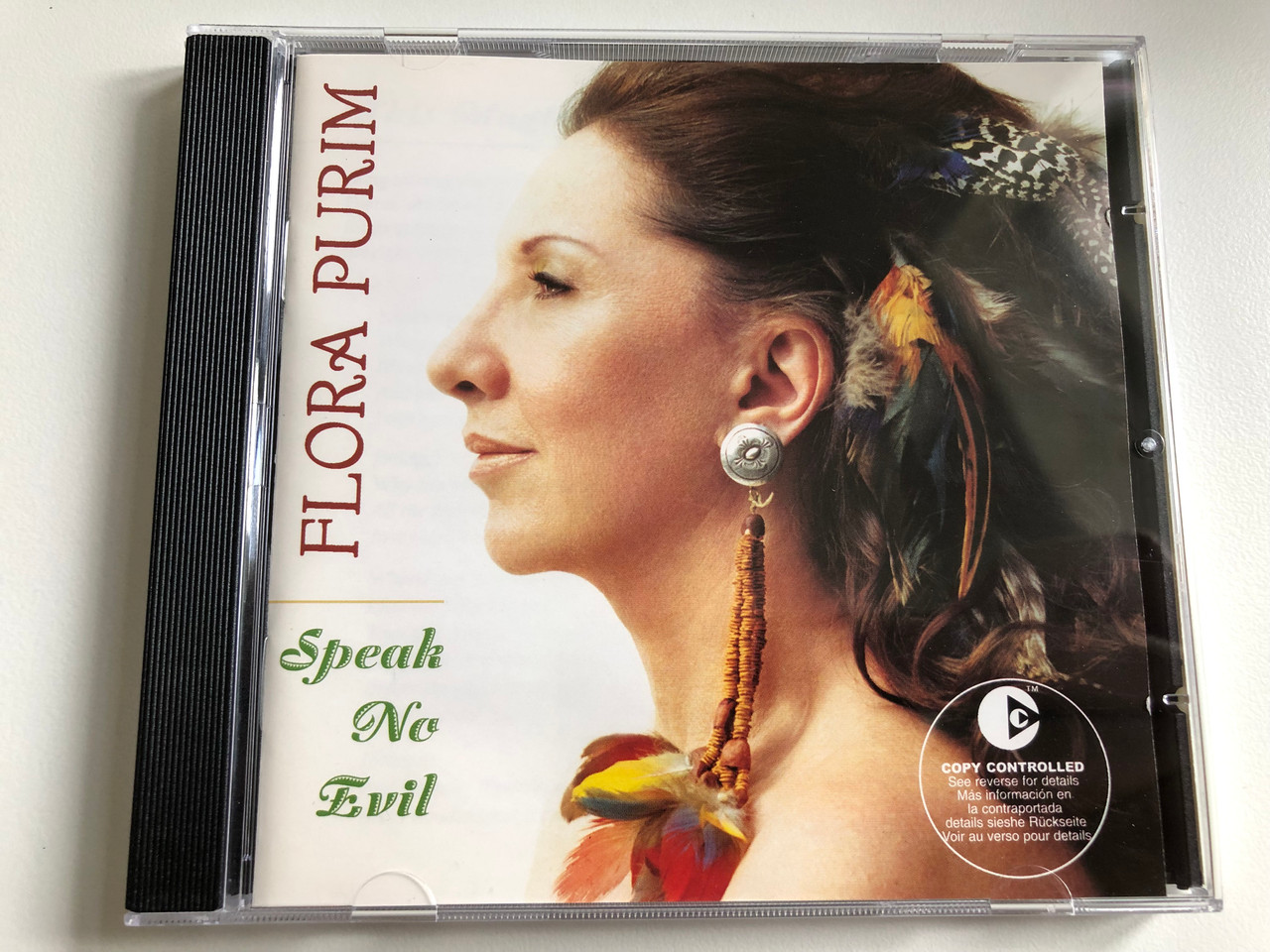 https://cdn10.bigcommerce.com/s-62bdpkt7pb/products/0/images/226537/Flora_Purim_Speak_No_Evil_Narada_Jazz_Audio_CD_2003_72435-43537-2-7_1__01586.1651657859.1280.1280.JPG?c=2&_gl=1*4sesl*_ga*MjA2NTIxMjE2MC4xNTkwNTEyNTMy*_ga_WS2VZYPC6G*MTY1MTY1NjA1Ni4zODIuMS4xNjUxNjU3MDgxLjQz