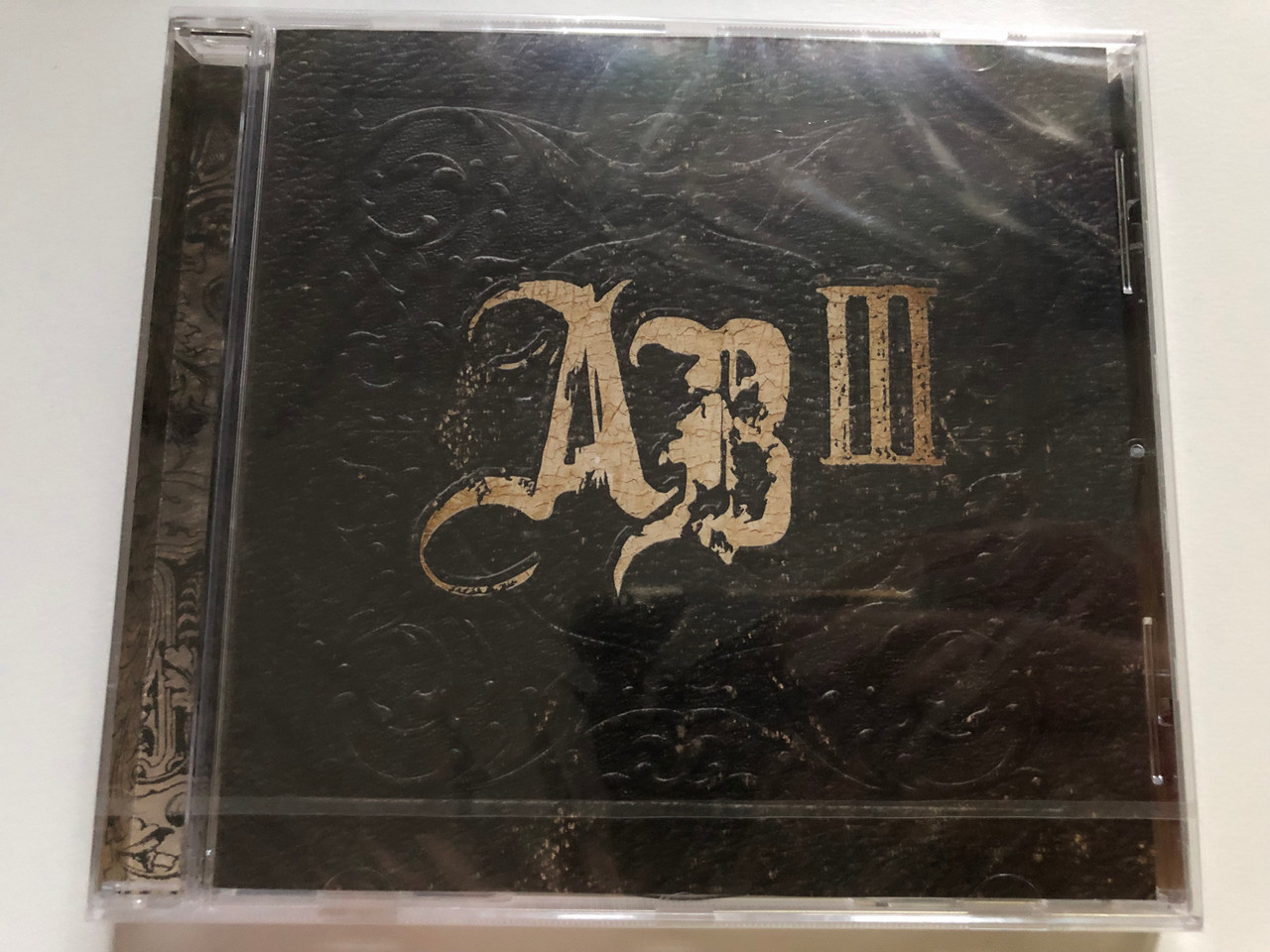 https://cdn10.bigcommerce.com/s-62bdpkt7pb/products/0/images/227014/Alter_Bridge_AB_III_Roadrunner_Records_Audio_CD_2010_RR_7737-2_1__62455.1652161863.1280.1280.JPG?c=2&_gl=1*16lahj6*_ga*MjA2NTIxMjE2MC4xNTkwNTEyNTMy*_ga_WS2VZYPC6G*MTY1MjE1NzAzOS4zODguMS4xNjUyMTYxNzMxLjQw