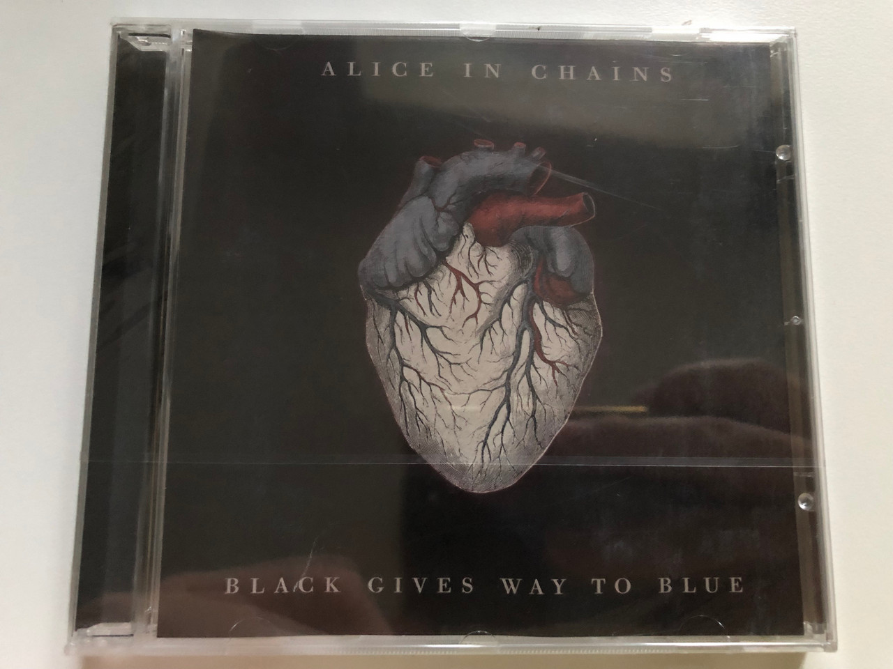 https://cdn10.bigcommerce.com/s-62bdpkt7pb/products/0/images/227016/Alice_In_Chains_Black_Gives_Way_To_Blue_Virgin_Audio_CD_2009_50999_3_08265_2_6_1__18884.1652162079.1280.1280.JPG?c=2&_gl=1*1nw27lt*_ga*MjA2NTIxMjE2MC4xNTkwNTEyNTMy*_ga_WS2VZYPC6G*MTY1MjE1NzAzOS4zODguMS4xNjUyMTYxOTQ3LjQ1