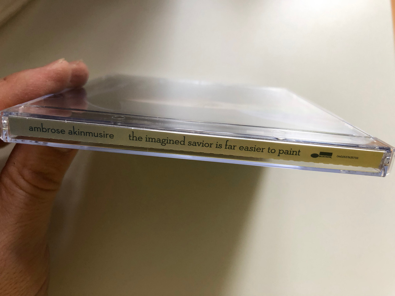 https://cdn10.bigcommerce.com/s-62bdpkt7pb/products/0/images/227241/Ambrose_Akinmusire_The_Imagined_Savior_Is_Far_Easier_To_Paint_Blue_Note_Audio_CD_2014_0602537635733_3__42549.1652249462.1280.1280.JPG?c=2&_gl=1*1jzt2wo*_ga*MjA2NTIxMjE2MC4xNTkwNTEyNTMy*_ga_WS2VZYPC6G*MTY1MjI0NzQ2MS4zOTEuMS4xNjUyMjQ5Mzg0LjMy