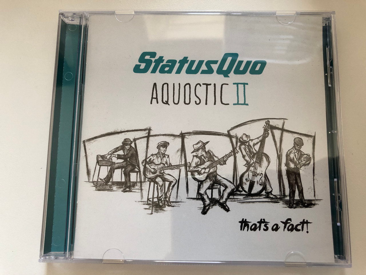 https://cdn10.bigcommerce.com/s-62bdpkt7pb/products/0/images/227281/Status_Quo_Aquostic_II_Thats_A_Fact_Ear_Music_2x_Audio_CD_2016_0211616EMU_1__30324.1652253609.1280.1280.JPG?c=2&_gl=1*eojpsk*_ga*MjA2NTIxMjE2MC4xNTkwNTEyNTMy*_ga_WS2VZYPC6G*MTY1MjI0NzQ2MS4zOTEuMS4xNjUyMjUzNDI5Ljc.