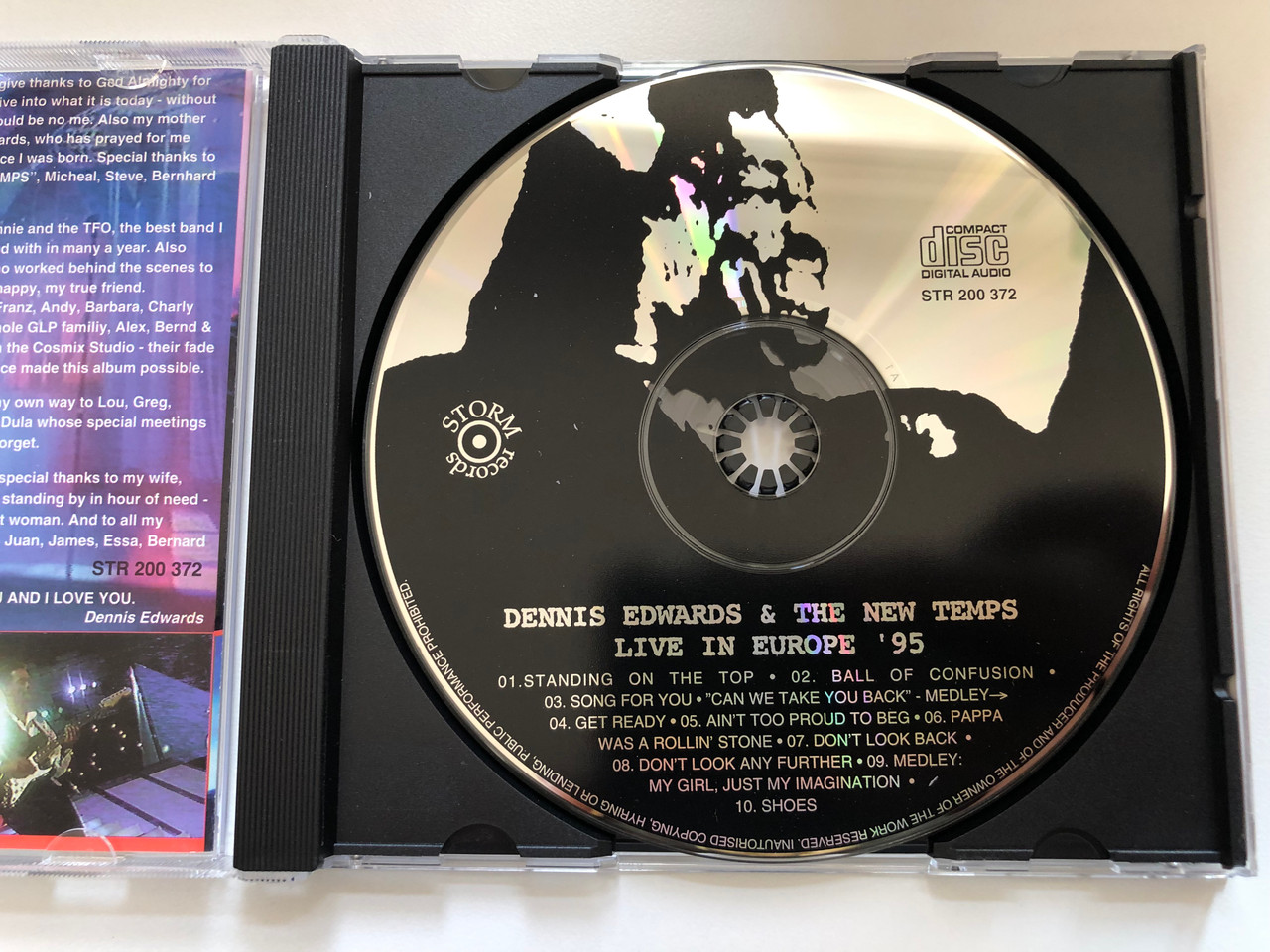 https://cdn10.bigcommerce.com/s-62bdpkt7pb/products/0/images/227390/Dennis_Edwards_The_New_Temps_Live_In_Europe_95_Storm_Records_Audio_CD_1995_STR_200_372_3__53375.1652362332.1280.1280.JPG?c=2&_gl=1*134ahy0*_ga*MjA2NTIxMjE2MC4xNTkwNTEyNTMy*_ga_WS2VZYPC6G*MTY1MjM2MTcxNy4zOTMuMS4xNjUyMzYyMTg4LjM4