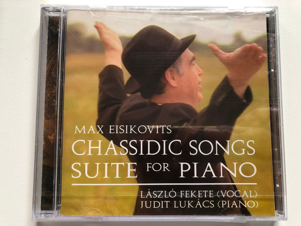 https://cdn10.bigcommerce.com/s-62bdpkt7pb/products/0/images/227868/Max_Eisikovits_-_Chassidic_Songs_Suite_For_Pano_-_Lszl_Fekete_vocal_Judit_Lukcs_piano_Audio_CD_2001_1__79408.1652799044.1280.1280.JPG?c=2&_gl=1*nh2pcv*_ga*MjA2NTIxMjE2MC4xNTkwNTEyNTMy*_ga_WS2VZYPC6G*MTY1Mjc5MjYyMC4zOTkuMS4xNjUyNzk5MDU3LjYw