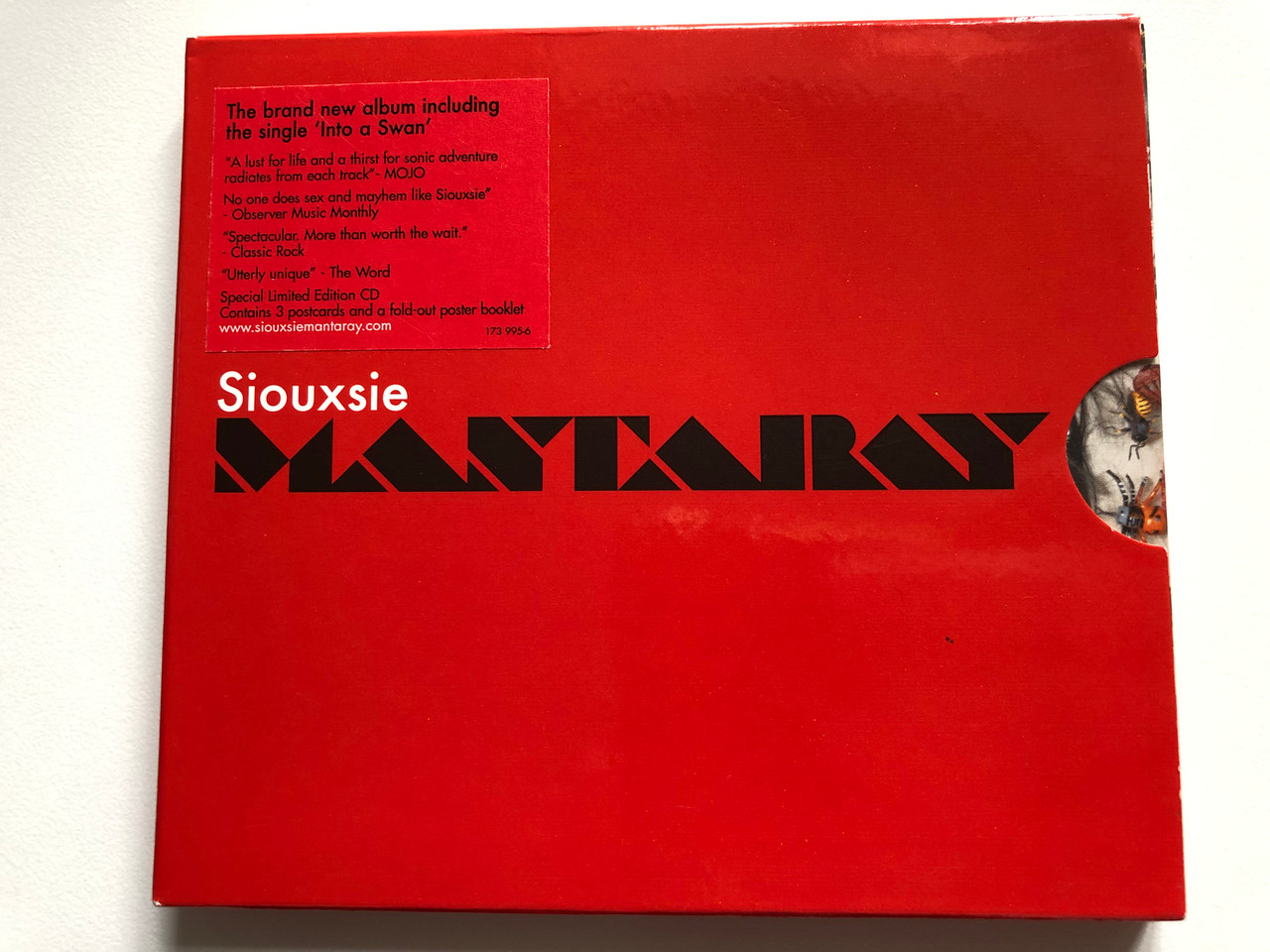 https://cdn10.bigcommerce.com/s-62bdpkt7pb/products/0/images/228000/Siouxsie_Mantaray_The_Brand_New_Album_including_the_single_Into_a_Swan_Special_Limited_Edition_CD_Contains_3_postcards_and_a_fold-out_poster_booklet_W14_Music_Audio_CD_2007_173_995-6_1__10209.1652862130.1280.1280.JPG?c=2&_gl=1*1e0fvn0*_ga*MjA2NTIxMjE2MC4xNTkwNTEyNTMy*_ga_WS2VZYPC6G*MTY1Mjg1NTcwMS40MDEuMS4xNjUyODYxOTU3LjQx