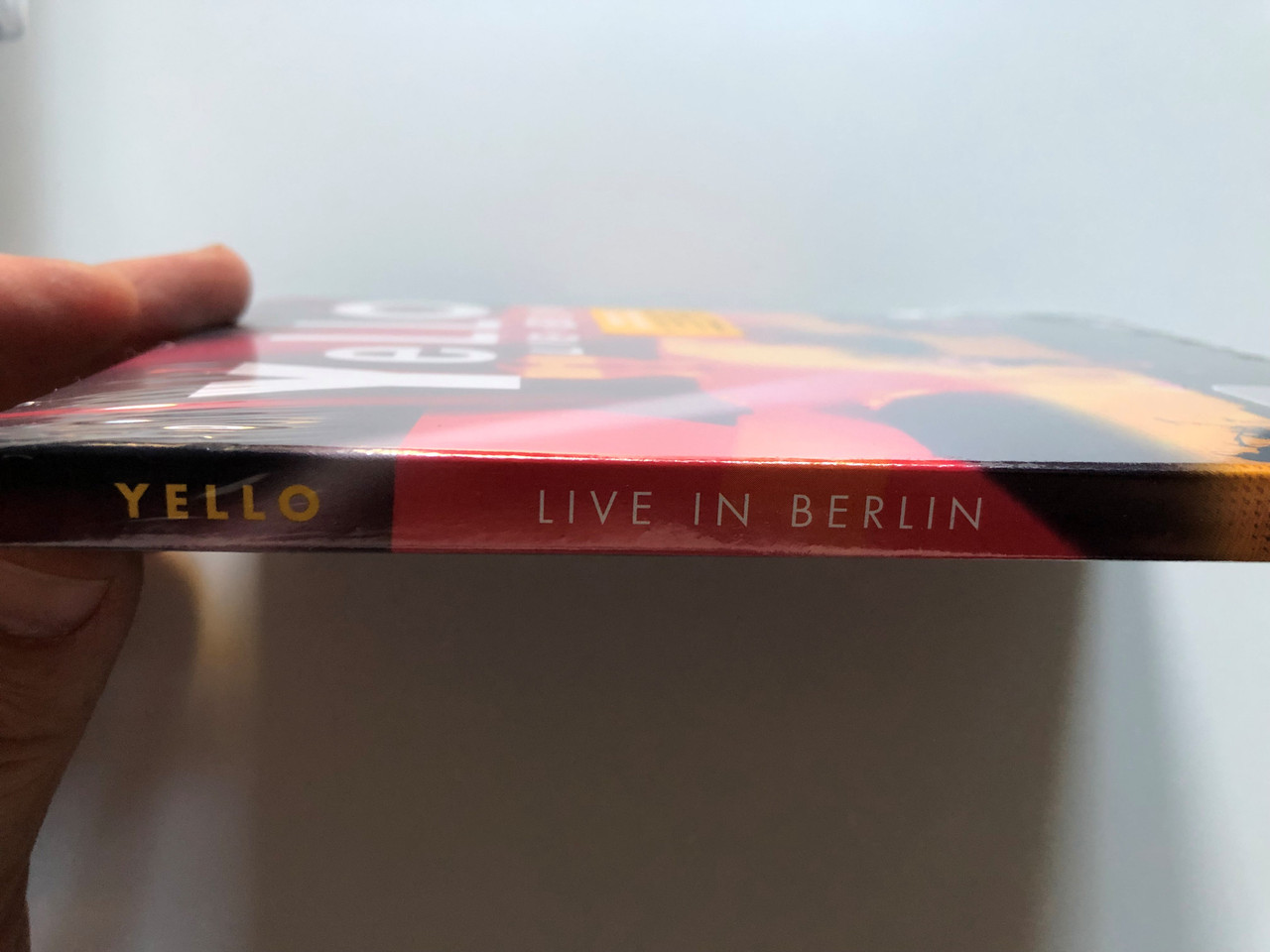 https://cdn10.bigcommerce.com/s-62bdpkt7pb/products/0/images/228096/Yello_Live_In_Berlin_First_Ever_Live_Concert_Incl._Songs_from_the_latest_Studio-Album_TOY_and_the_Hits_Oh_Yeah_The_Race_many_more_Polydor_DVD_Video_2017_0602567062301_3__50325.1652964545.1280.1280.JPG?c=2&_gl=1*1ofiqgk*_ga*MjA2NTIxMjE2MC4xNTkwNTEyNTMy*_ga_WS2VZYPC6G*MTY1Mjk2MDk4Ni40MDQuMS4xNjUyOTY0MjYzLjY.