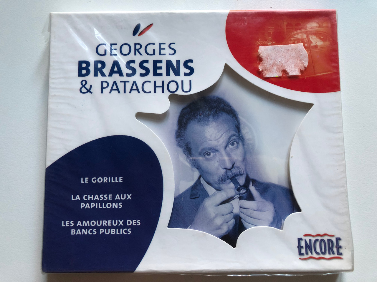 https://cdn10.bigcommerce.com/s-62bdpkt7pb/products/0/images/228194/Georges_Brassens_Patachou_-_Le_Gorille_La_Chasse_Aux_Papillons_Les_Amoureux_Des_Bancs_Publics_Encore_Audio_CD_2004_ENC043_1__41185.1653056085.1280.1280.JPG?c=2&_gl=1*15ah5cc*_ga*MjA2NTIxMjE2MC4xNTkwNTEyNTMy*_ga_WS2VZYPC6G*MTY1MzA1NDg0MC40MDUuMS4xNjUzMDU1OTIxLjk.