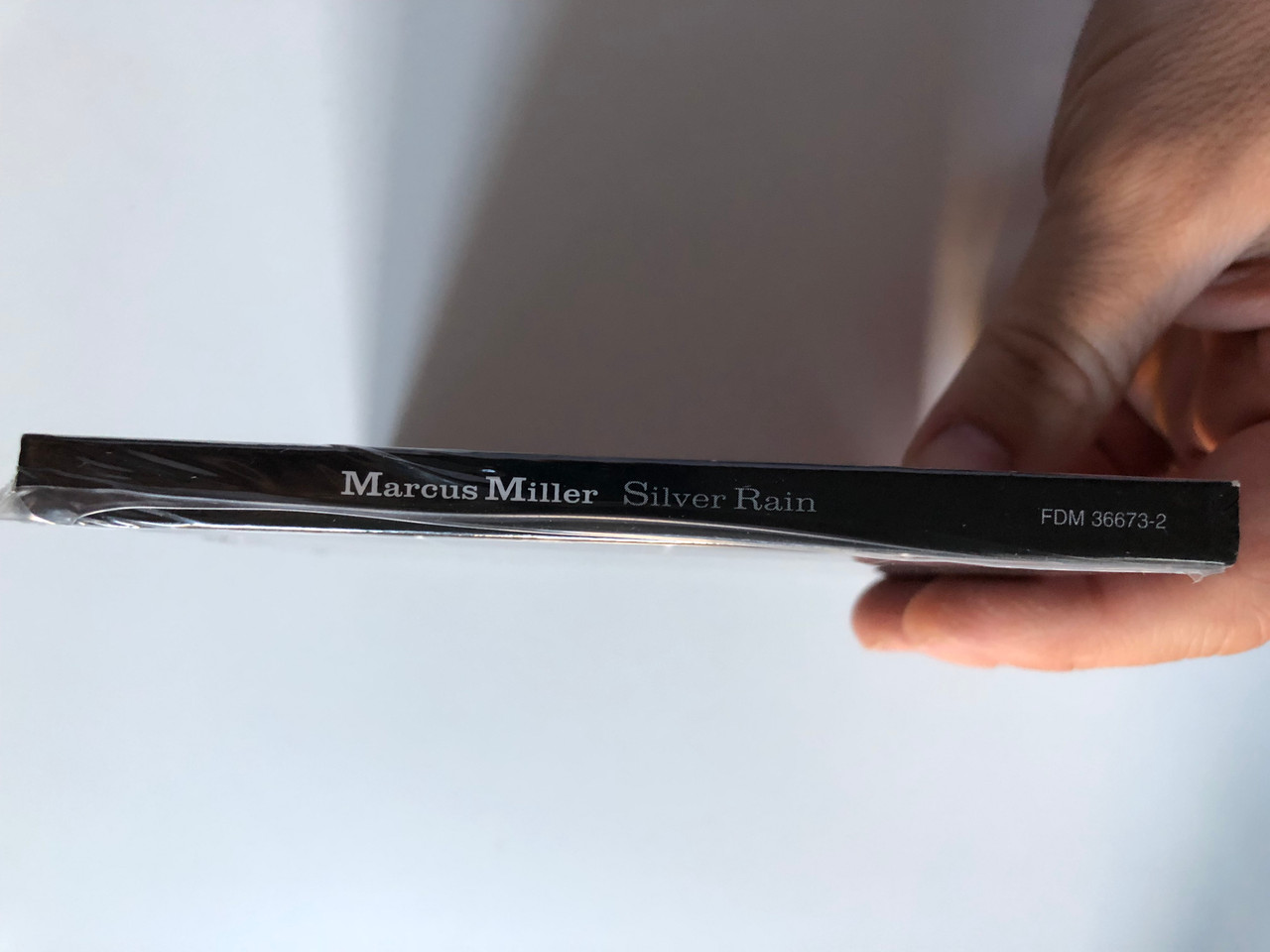 https://cdn10.bigcommerce.com/s-62bdpkt7pb/products/0/images/228238/Marcus_Miller_Silver_Rain_3_Deuces_Records_Audio_CD_2005_FDM_36673-2_3__80923.1653060563.1280.1280.JPG?c=2&_gl=1*jxfebb*_ga*MjA2NTIxMjE2MC4xNTkwNTEyNTMy*_ga_WS2VZYPC6G*MTY1MzA1NDg0MC40MDUuMS4xNjUzMDYwMjkwLjU2