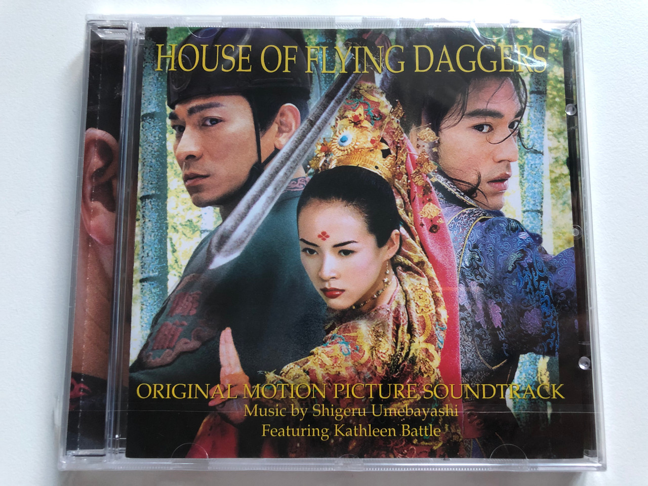 https://cdn10.bigcommerce.com/s-62bdpkt7pb/products/0/images/228563/House_Of_Flying_Daggers_Original_Motion_Picture_Soundtrack_-_Music_By_Shigeru_Umebayashi_Featuring_Kathleen_Battle_Sony_Classical_Audio_CD_2004_SK_93561_1__78879.1653384774.1280.1280.JPG?c=2&_gl=1*fnxabx*_ga*MjA2NTIxMjE2MC4xNTkwNTEyNTMy*_ga_WS2VZYPC6G*MTY1MzM3MTM3Ni40MDguMS4xNjUzMzg0Njc0LjQz