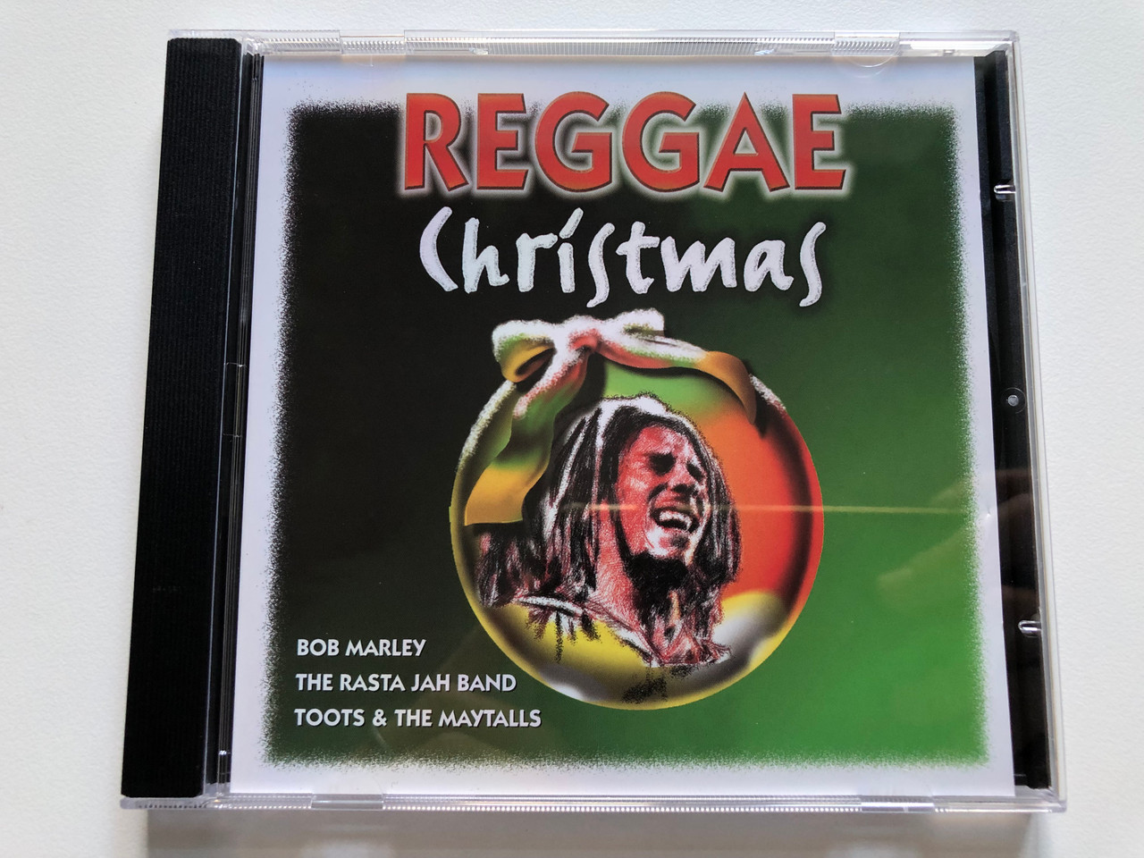 https://cdn10.bigcommerce.com/s-62bdpkt7pb/products/0/images/228651/Reggae_Christmas_Bob_Marley_The_Rasta_Jah_Band_Toots_The_Maytalls_Weton-Wesgram_Audio_CD_1999_JB053_1__60999.1653458015.1280.1280.JPG?c=2&_gl=1*13q0hqx*_ga*MjA2NTIxMjE2MC4xNTkwNTEyNTMy*_ga_WS2VZYPC6G*MTY1MzQ1MjE0OC40MDkuMS4xNjUzNDU3ODk5LjU4