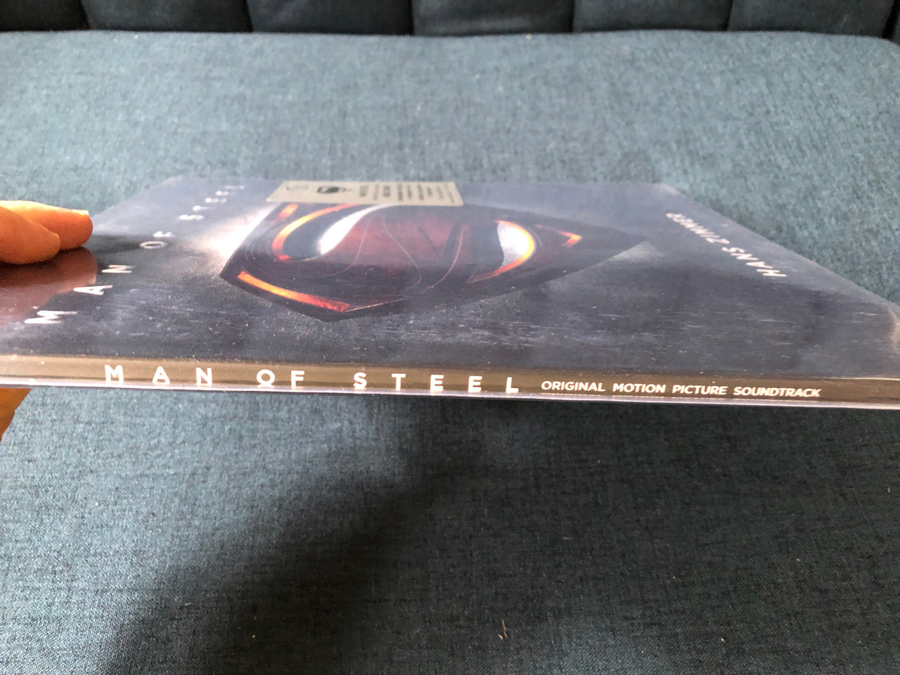 https://cdn10.bigcommerce.com/s-62bdpkt7pb/products/0/images/230414/Man_Of_Steel_-_Hans_Zimmer_Motion_Picture_Soundtrack_By_Hans_Zimmer._Limited_edition_of_2008_copies_on_translucent_red_vinyl._Includes_a_4-page_booklet_fridge_magnet._180_gram_audiophile_4__77749.1654014649.1280.1280.JPG?c=2&_gl=1*11efl2a*_ga*MjA2NTIxMjE2MC4xNTkwNTEyNTMy*_ga_WS2VZYPC6G*MTY1NDAwNTAzNy40MTUuMS4xNjU0MDE0NTk4LjYw
