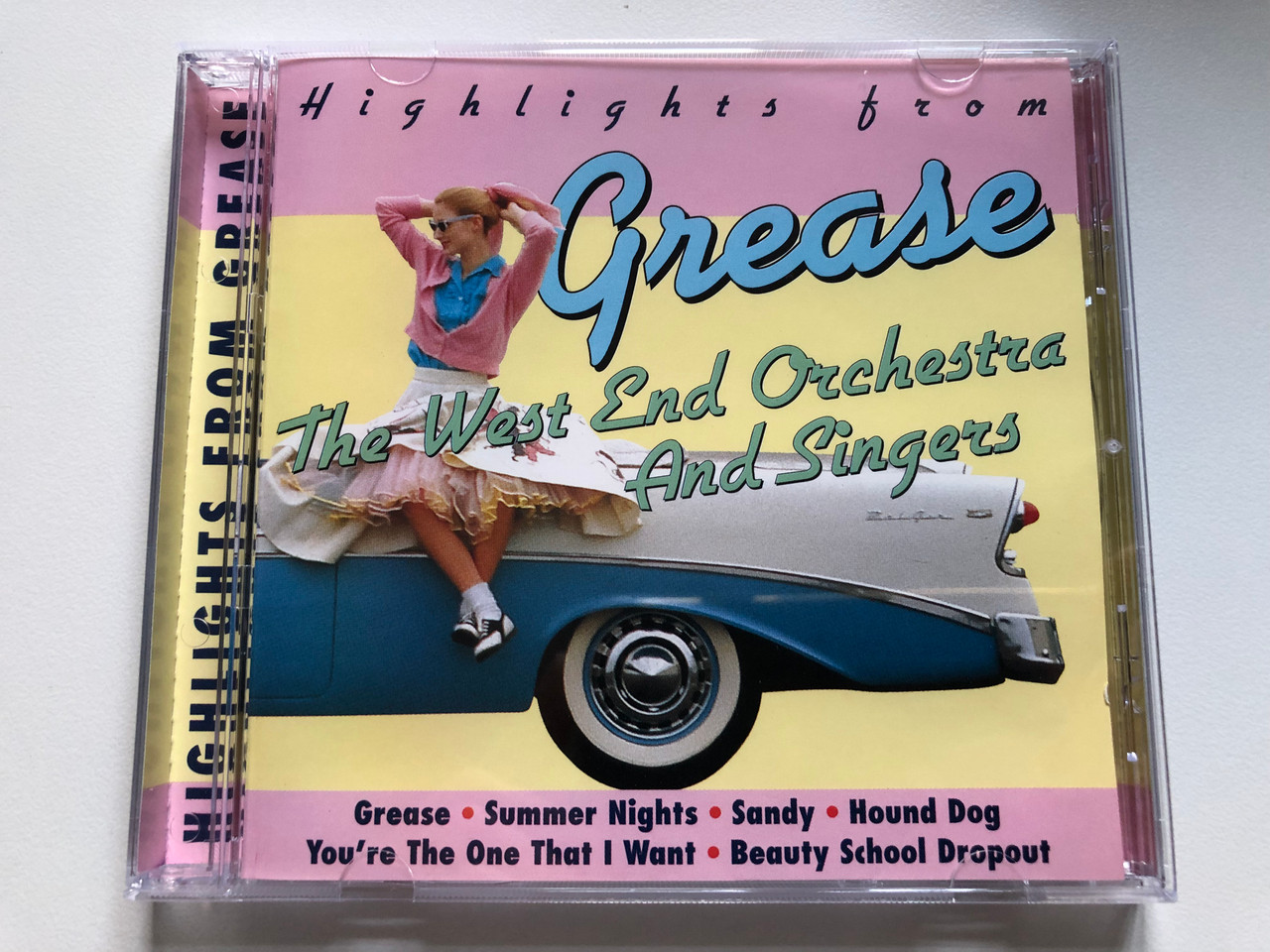 https://cdn10.bigcommerce.com/s-62bdpkt7pb/products/0/images/230779/Highlights_From_Grease_-_The_West_End_Orchestra_And_Singers_Grease_Summer_Nights_Sandy_Hound_Dog_Youre_The_One_That_I_Want_Beauty_School_Dropout_TRC_Music_Audio_CD_1998_97413E_1__25135.1654109956.1280.1280.JPG?c=2&_gl=1*1vus710*_ga*MjA2NTIxMjE2MC4xNTkwNTEyNTMy*_ga_WS2VZYPC6G*MTY1NDEwMjIxMy40MTguMS4xNjU0MTA5NzgwLjUx
