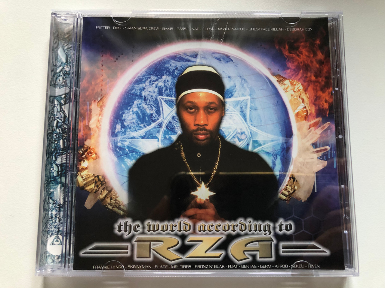 https://cdn10.bigcommerce.com/s-62bdpkt7pb/products/0/images/230794/The_World_According_To_RZA_Frankie_Hi-NRG_MC_Blade_Mr._Ti2bs_Bronz_N_Blak_Fuat_Bektas_Germ_Afrob_Sekou_Feven_Virgin_Audio_CD_2003_724358383829_1__08392.1654113190.1280.1280.JPG?c=2&_gl=1*rb9hvp*_ga*MjA2NTIxMjE2MC4xNTkwNTEyNTMy*_ga_WS2VZYPC6G*MTY1NDEwMjIxMy40MTguMS4xNjU0MTEyODU5LjQ5
