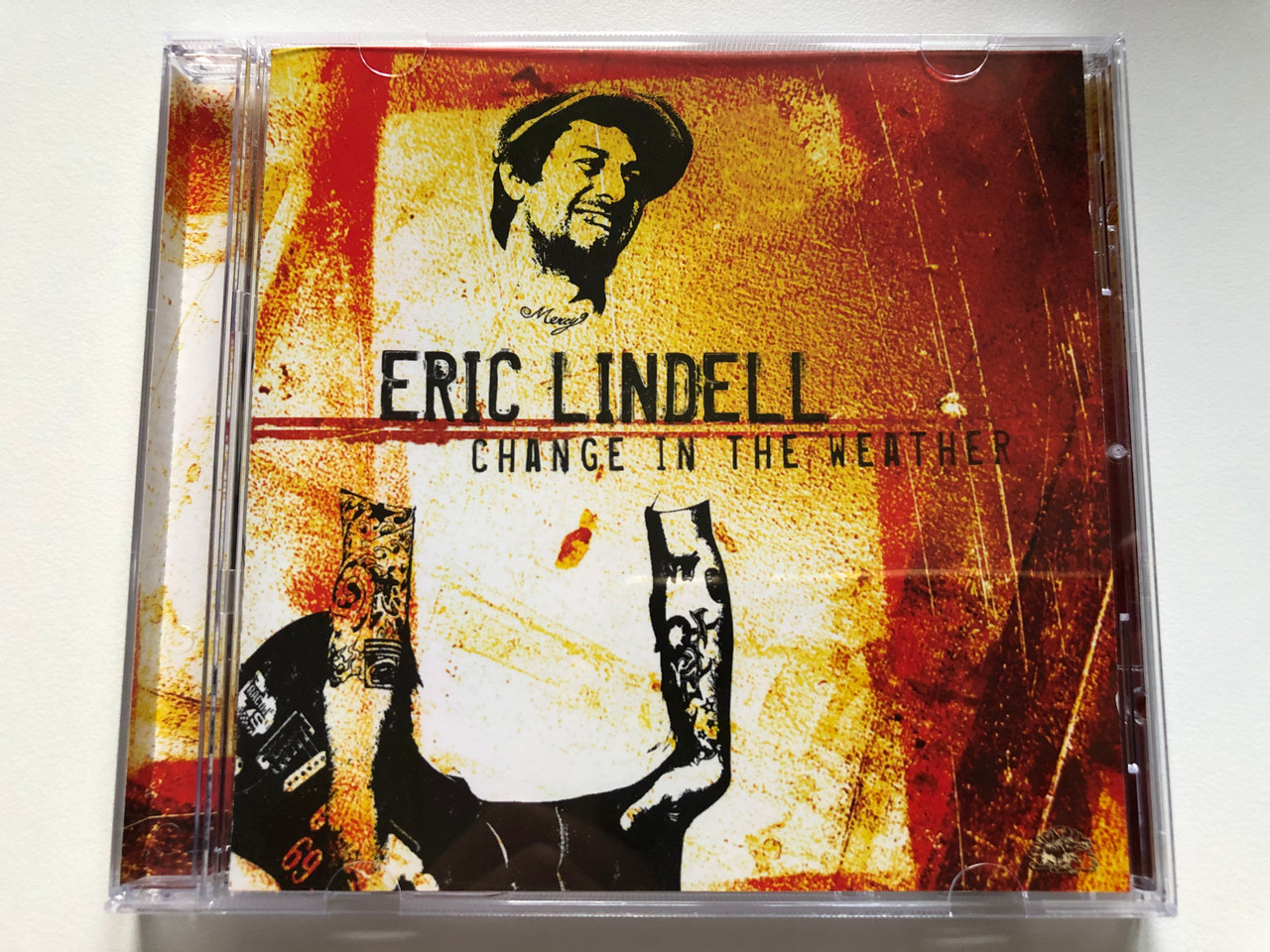 https://cdn10.bigcommerce.com/s-62bdpkt7pb/products/0/images/231068/Eric_Lindell_Change_In_The_Weather_Alligator_Records_Audio_CD_2006_ALCD_4908_1__40052.1654179287.1280.1280.JPG?c=2&_gl=1*6sqljy*_ga*MjA2NTIxMjE2MC4xNTkwNTEyNTMy*_ga_WS2VZYPC6G*MTY1NDE3Nzk5OS40MTkuMS4xNjU0MTc4OTcyLjU5