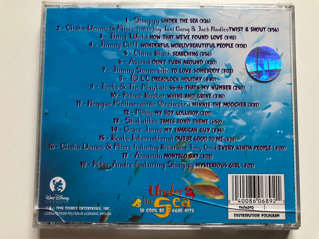 https://cdn10.bigcommerce.com/s-62bdpkt7pb/products/0/images/231308/Under_The_Sea_-_18_Cool_Reggae_Hits_Shaggy_Aswad_Jimmy_Cliff_Grace_Jones_Jimmy_Somerville_Chaka_Demus_Pliers_Third_World_China_Black_Walt_Disney_Records_Audio_CD_1998_0606892_1__09122.1654246452.1280.1280.JPG?c=2&_gl=1*4amts5*_ga*MjA2NTIxMjE2MC4xNTkwNTEyNTMy*_ga_WS2VZYPC6G*MTY1NDIzNDU5Mi40MjEuMS4xNjU0MjQ1OTQ2LjIw
