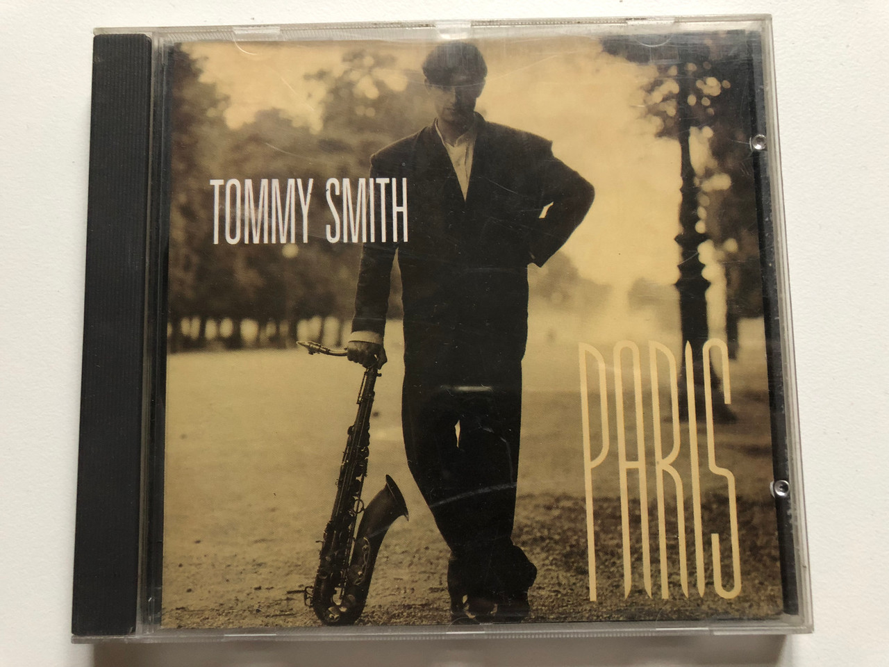 https://cdn10.bigcommerce.com/s-62bdpkt7pb/products/0/images/232252/Tommy_Smith_Paris_Blue_Note_International_Audio_CD_1992_077778061229_1__79548.1654534152.1280.1280.JPG?c=2&_gl=1*1tbvmrz*_ga*MjA2NTIxMjE2MC4xNTkwNTEyNTMy*_ga_WS2VZYPC6G*MTY1NDUzMzI0OC40MjIuMS4xNjU0NTMzOTQ5LjYw
