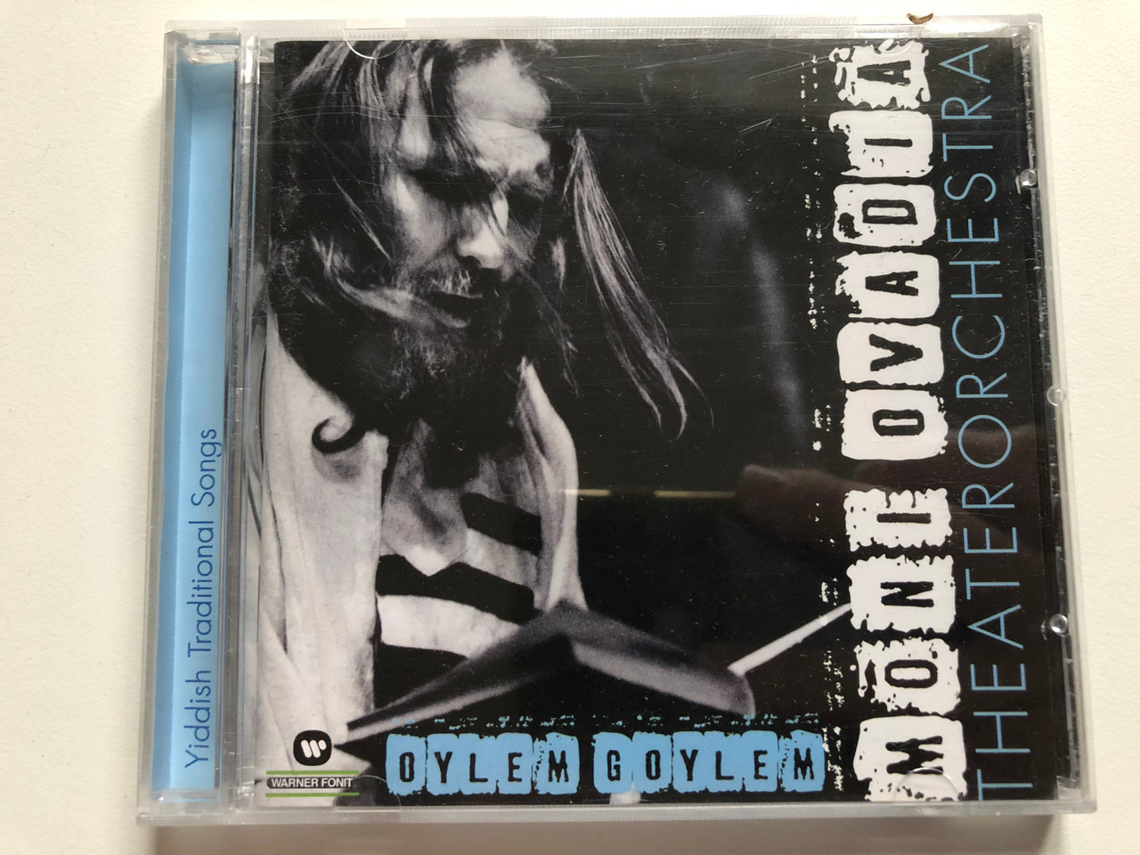 https://cdn10.bigcommerce.com/s-62bdpkt7pb/products/0/images/232267/Moni_Ovadia_TheaterOrchestra_Oylem_Goylem_Warner_Fonit_Audio_CD_1999_3984_26906-2_1__10896.1654536127.1280.1280.JPG?c=2&_gl=1*1eu78g8*_ga*MjA2NTIxMjE2MC4xNTkwNTEyNTMy*_ga_WS2VZYPC6G*MTY1NDUzMzI0OC40MjIuMS4xNjU0NTM1OTQ5LjQ1