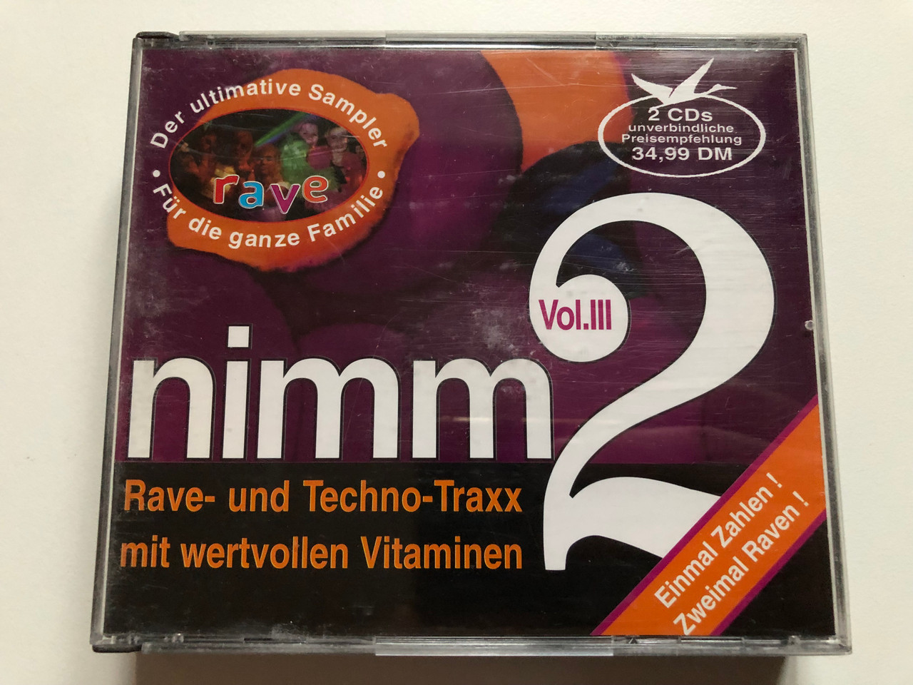 https://cdn10.bigcommerce.com/s-62bdpkt7pb/products/0/images/232604/Nimm_2_-_Vol._III_Rave-und_Techno-Traxx_mit_wertvollen_Vitaminen_Der_ultimative_Sampler._Fur_die_ganze_Familie_Einmal_Zahlen_Zweimal_Raven_Sub_Terranean_2x_Audio_CD_SPV_085-47172_1__15042.1654623764.1280.1280.JPG?c=2&_gl=1*e2mc3r*_ga*MjA2NTIxMjE2MC4xNTkwNTEyNTMy*_ga_WS2VZYPC6G*MTY1NDYxNzg5Ny40MjMuMS4xNjU0NjIzMTMxLjU2