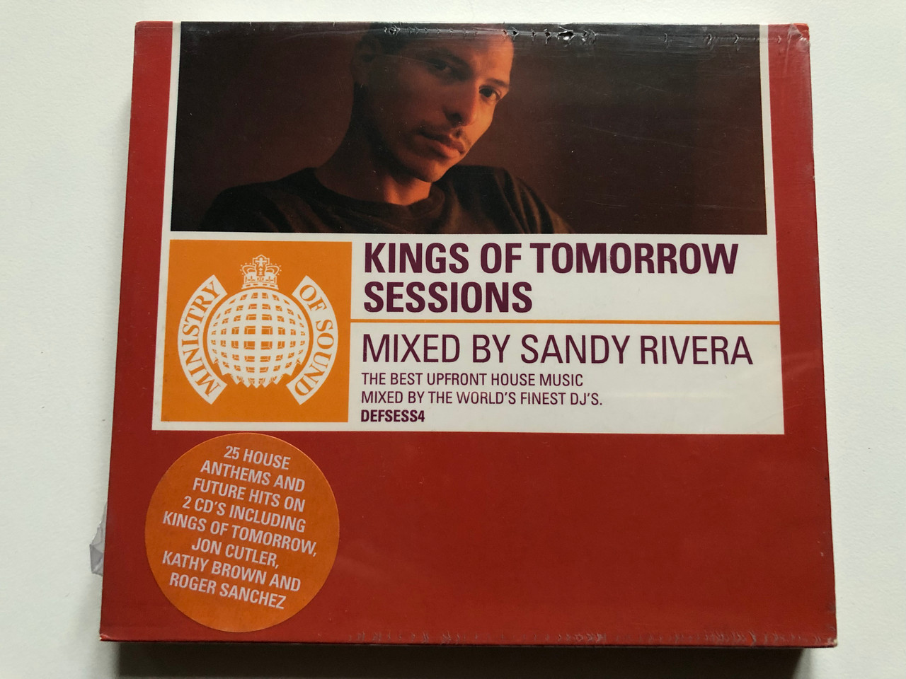 https://cdn10.bigcommerce.com/s-62bdpkt7pb/products/0/images/232984/Kings_Of_Tomorrow_Sessions_-_Mixed_By_Sandy_Rivera_The_Best_Upfront_House_Music_Mixed_By_The_Worlds_Finest_DJs._25_House_Anthems_And_Future_Hits_On_2_CDs_Including_Kings_Of_Tomorrow_Jon_1__22360.1654721321.1280.1280.JPG?c=2&_gl=1*19mklc3*_ga*MjA2NTIxMjE2MC4xNTkwNTEyNTMy*_ga_WS2VZYPC6G*MTY1NDcxNDYwMy40MjUuMS4xNjU0NzIxMDk4LjUy