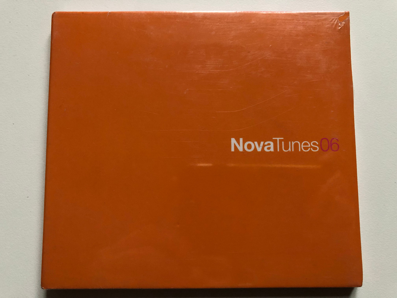 https://cdn10.bigcommerce.com/s-62bdpkt7pb/products/0/images/233287/Nova_Tunes_06_Nova_Records_Audio_CD_2002_3076282_1__69566.1654877409.1280.1280.JPG?c=2&_gl=1*1h52ey5*_ga*MjA2NTIxMjE2MC4xNTkwNTEyNTMy*_ga_WS2VZYPC6G*MTY1NDg3MjEwNi40MjkuMS4xNjU0ODc3Mjc2LjE1