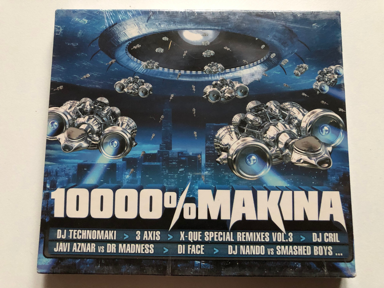 https://cdn10.bigcommerce.com/s-62bdpkt7pb/products/0/images/235023/10000_Makina_DJ_Technomaki_3_Axis_X-Que_Special_Remixes_Vol._3_DJ_Gril_Javi_Aznar_vs_Dr_Madness_Di_Face_DJ_Nando_vs_Smashed_Boys..._Wagram_Music_2x_Audio_CD_2006_3114102_1__71455.1655730903.1280.1280.JPG?c=2&_gl=1*jqqos4*_ga*MjA2NTIxMjE2MC4xNTkwNTEyNTMy*_ga_WS2VZYPC6G*MTY1NTcyNzYxOC40NDMuMS4xNjU1NzMwOTA1LjYw