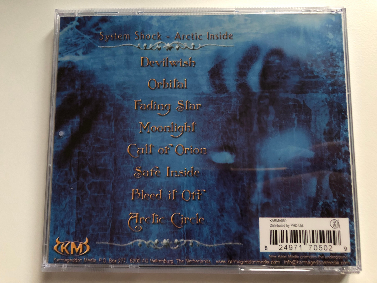 https://cdn10.bigcommerce.com/s-62bdpkt7pb/products/0/images/235084/System_Shock_Arctic_Inside_Karmageddon_Media_Audio_CD_KARMA050_4__03630.1655747135.1280.1280.JPG?c=2&_gl=1*kvbc3b*_ga*MjA2NTIxMjE2MC4xNTkwNTEyNTMy*_ga_WS2VZYPC6G*MTY1NTc0MjI5OS40NDUuMS4xNjU1NzQ3MDA5LjM5