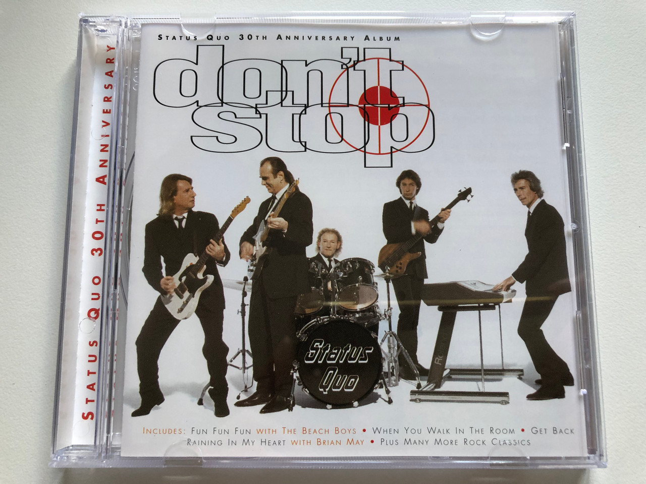 https://cdn10.bigcommerce.com/s-62bdpkt7pb/products/0/images/235213/Status_Quo_30th_Anniversary_Album_-_Dont_Stop_Includes_Fun_Fun_Fun_with_The_Beach_Boys_When_You_Walk_In_The_Room_Get_Back_Raining_In_My_Heart_With_Brian_May_Plus_Many_More_Rock_Classi_1__87640.1655827697.1280.1280.JPG?c=2&_gl=1*4k9970*_ga*MjA2NTIxMjE2MC4xNTkwNTEyNTMy*_ga_WS2VZYPC6G*MTY1NTgxOTg2NC40NDYuMS4xNjU1ODI3MDIxLjU4