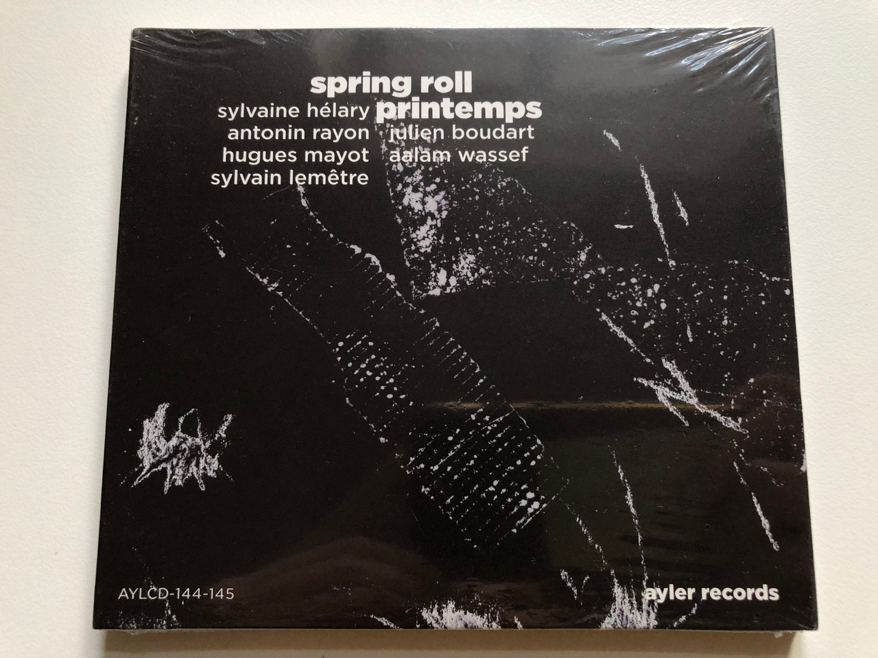 https://cdn10.bigcommerce.com/s-62bdpkt7pb/products/0/images/235369/Sylvaine_Hlary_Spring_Roll_Printemps_Antonin_Rayon_Julien_Boudart_Hugues_Mayot_Aalam_Wassef_Sylvain_Lemetre_Ayler_Records_2x_Audio_CD_2014_AYLCD-144-145_1__74778.1655914405.1280.1280.JPG?c=2&_gl=1*1hwfuc2*_ga*MjA2NTIxMjE2MC4xNTkwNTEyNTMy*_ga_WS2VZYPC6G*MTY1NTkwNTkyMS40NDguMS4xNjU1OTE0MDM4LjE5