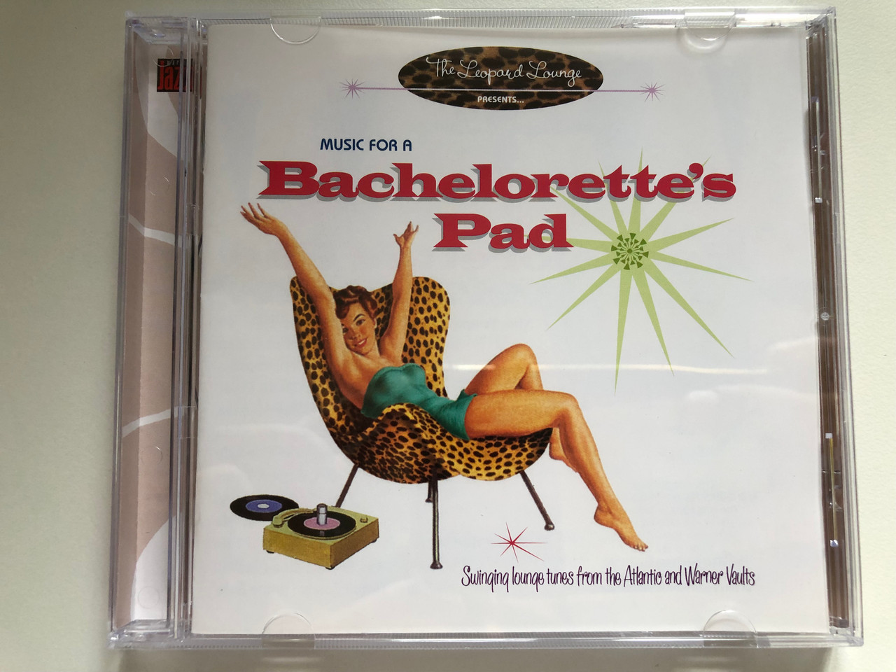 https://cdn10.bigcommerce.com/s-62bdpkt7pb/products/0/images/235585/Music_For_A_Bachelorettes_Pad_Swinging_Lounge_Tunes_From_The_Atlantic_And_Warner_Vaults_-_The_Leopard_Lounge_Presents_Warner_Jazz_Audio_CD_2005_5046782702_1__51480.1656045748.1280.1280.JPG?c=2&_gl=1*11opg22*_ga*MjA2NTIxMjE2MC4xNTkwNTEyNTMy*_ga_WS2VZYPC6G*MTY1NjA0NDk4Mi40NTEuMS4xNjU2MDQ1NjMwLjUw