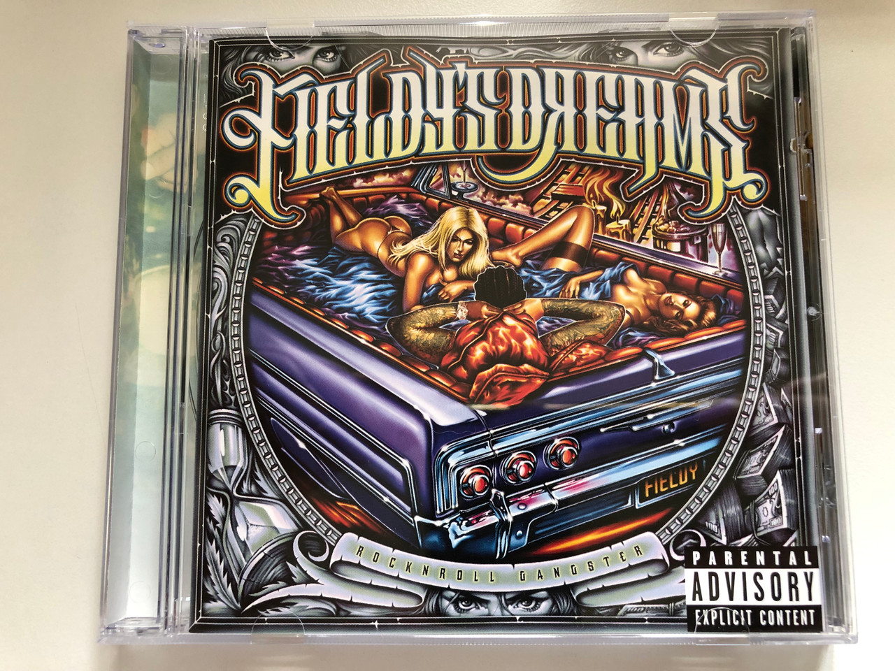 https://cdn10.bigcommerce.com/s-62bdpkt7pb/products/0/images/235613/Fieldys_Dreams_Rock_N_Roll_Gangster_Epic_Audio_CD_2002_505448_2_1__38234.1656050825.1280.1280.JPG?c=2&_gl=1*5l6vne*_ga*MjA2NTIxMjE2MC4xNTkwNTEyNTMy*_ga_WS2VZYPC6G*MTY1NjA0NDk4Mi40NTEuMS4xNjU2MDUwNzQ5LjI3