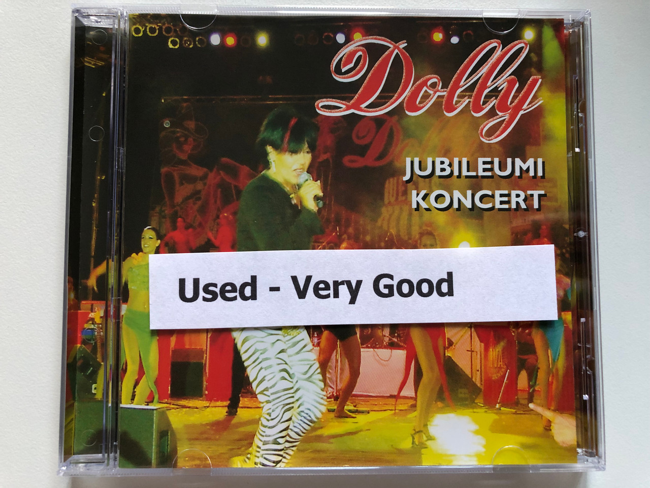 https://cdn10.bigcommerce.com/s-62bdpkt7pb/products/0/images/236174/Dolly_Jubileumi_Koncert_Warner_Music_Hungary_Audio_CD_2003_5046_70413_2_7__03259.1656485961.1280.1280.JPG?c=2&_gl=1*1rt9dpy*_ga*MjA2NTIxMjE2MC4xNTkwNTEyNTMy*_ga_WS2VZYPC6G*MTY1NjQ3NDAwNS40NTguMS4xNjU2NDg1NjkxLjQ3