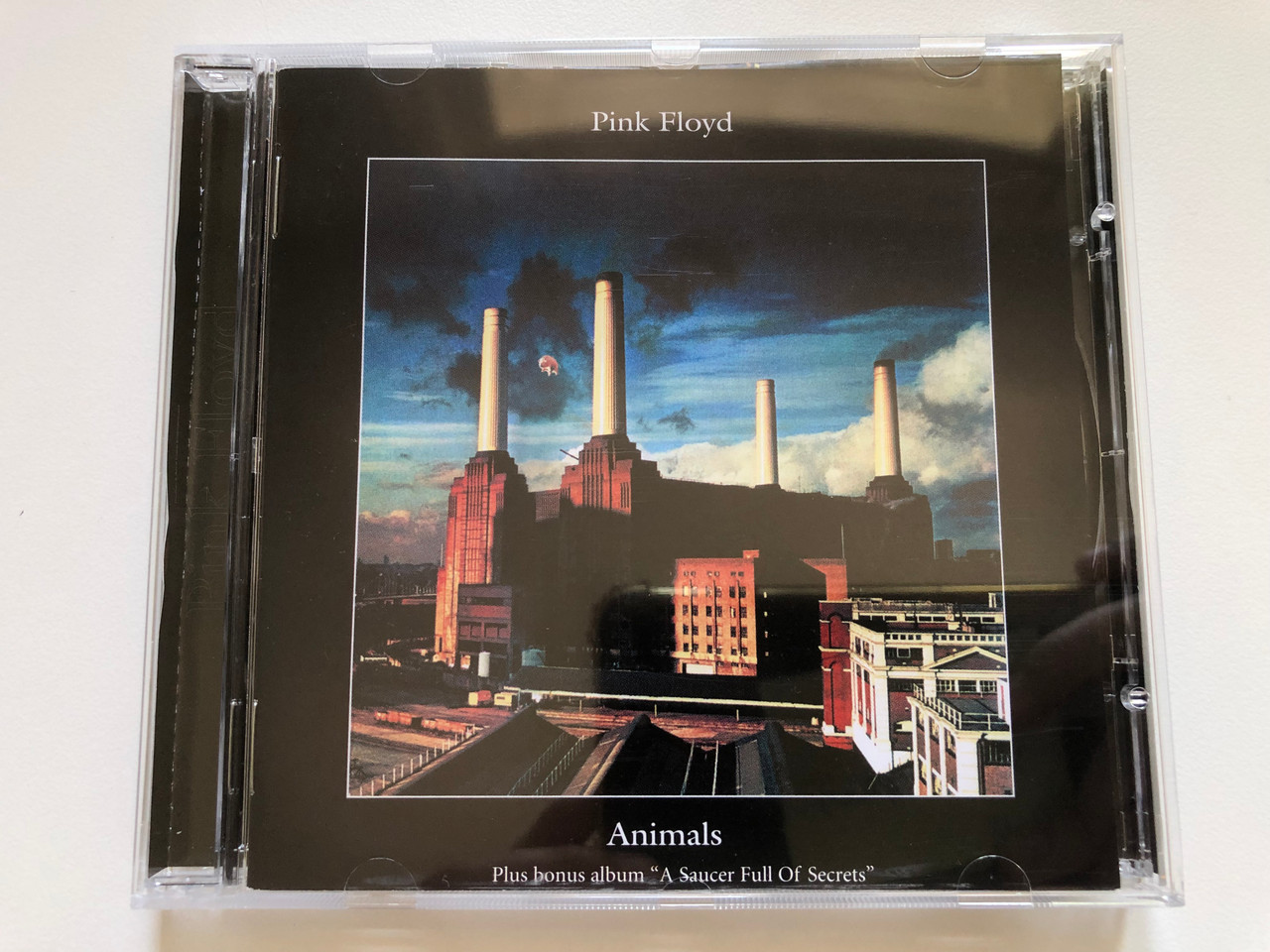 https://cdn10.bigcommerce.com/s-62bdpkt7pb/products/0/images/237516/Pink_Floyd_Animals_Plus_Bonus_Album_A_Saucerful_Of_Secrets_EMI_Audio_CD_2000_077778056829_1__90287.1657190683.1280.1280.JPG?c=2&_gl=1*prccet*_ga*MjA2NTIxMjE2MC4xNTkwNTEyNTMy*_ga_WS2VZYPC6G*MTY1NzE4OTg2MC40NjkuMS4xNjU3MTkwNDI5LjM1