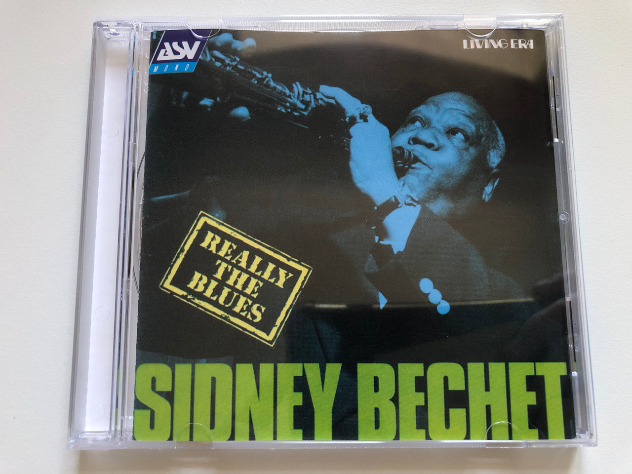 https://cdn10.bigcommerce.com/s-62bdpkt7pb/products/0/images/237581/Sidney_Bechet_Really_The_Blues_ASV_Audio_CD_1993_Mono_CD_AJA_5107_1__26103.1657202809.1280.1280.JPG?c=2&_gl=1*zogklb*_ga*MjA2NTIxMjE2MC4xNTkwNTEyNTMy*_ga_WS2VZYPC6G*MTY1NzIwMTc3OS40NzEuMS4xNjU3MjAyNjU5LjU4