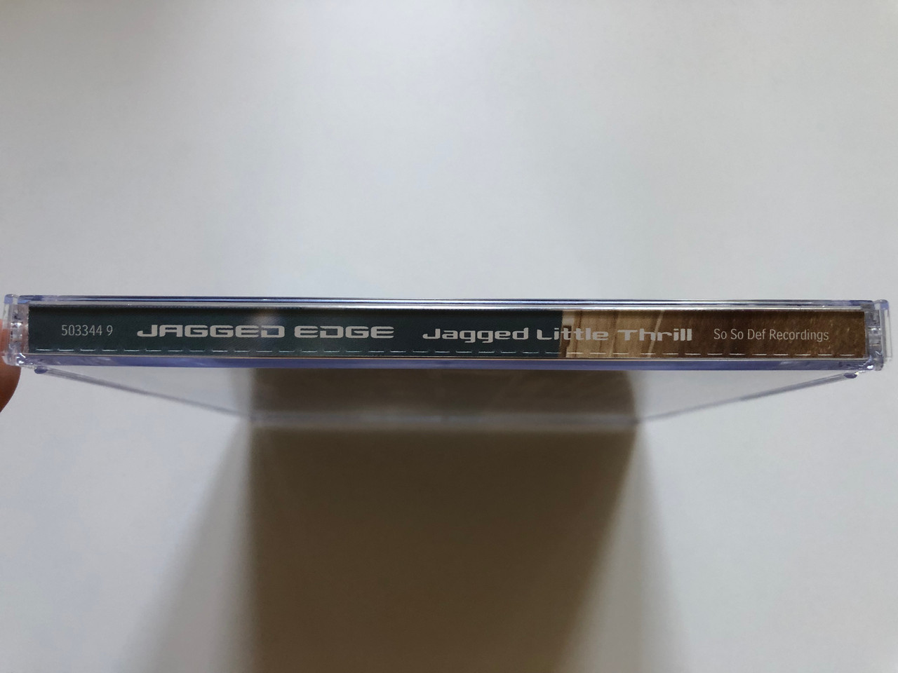 https://cdn10.bigcommerce.com/s-62bdpkt7pb/products/0/images/237664/Jagged_Edge_Jagged_Little_Thrill_So_So_Def_Audio_CD_2001_503344_94_3__99397.1657219291.1280.1280.JPG?c=2&_gl=1*vthbhw*_ga*MjA2NTIxMjE2MC4xNTkwNTEyNTMy*_ga_WS2VZYPC6G*MTY1NzIxODY5NC40NzIuMS4xNjU3MjE5MTIzLjE5