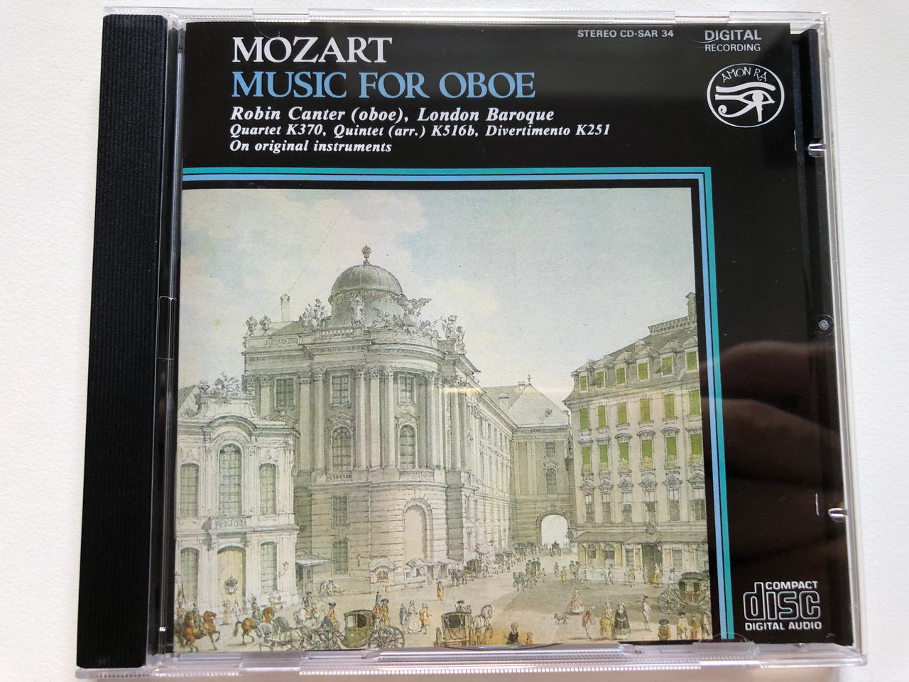 https://cdn10.bigcommerce.com/s-62bdpkt7pb/products/0/images/238171/Mozart_-_Music_For_Oboe_-_Robin_Canter_oboe_London_Baroque_Quartet_K370_Quintet_arr._K516b_Divertimento_K251_On_original_instruments_Amon_Ra_Audio_CD_1988_Stereo_CD-SAR_34_1__72490.1657525434.1280.1280.JPG?c=2&_gl=1*15llnp6*_ga*MjA2NTIxMjE2MC4xNTkwNTEyNTMy*_ga_WS2VZYPC6G*MTY1NzUxNzY2Ni40NzYuMS4xNjU3NTI1MTUwLjUx