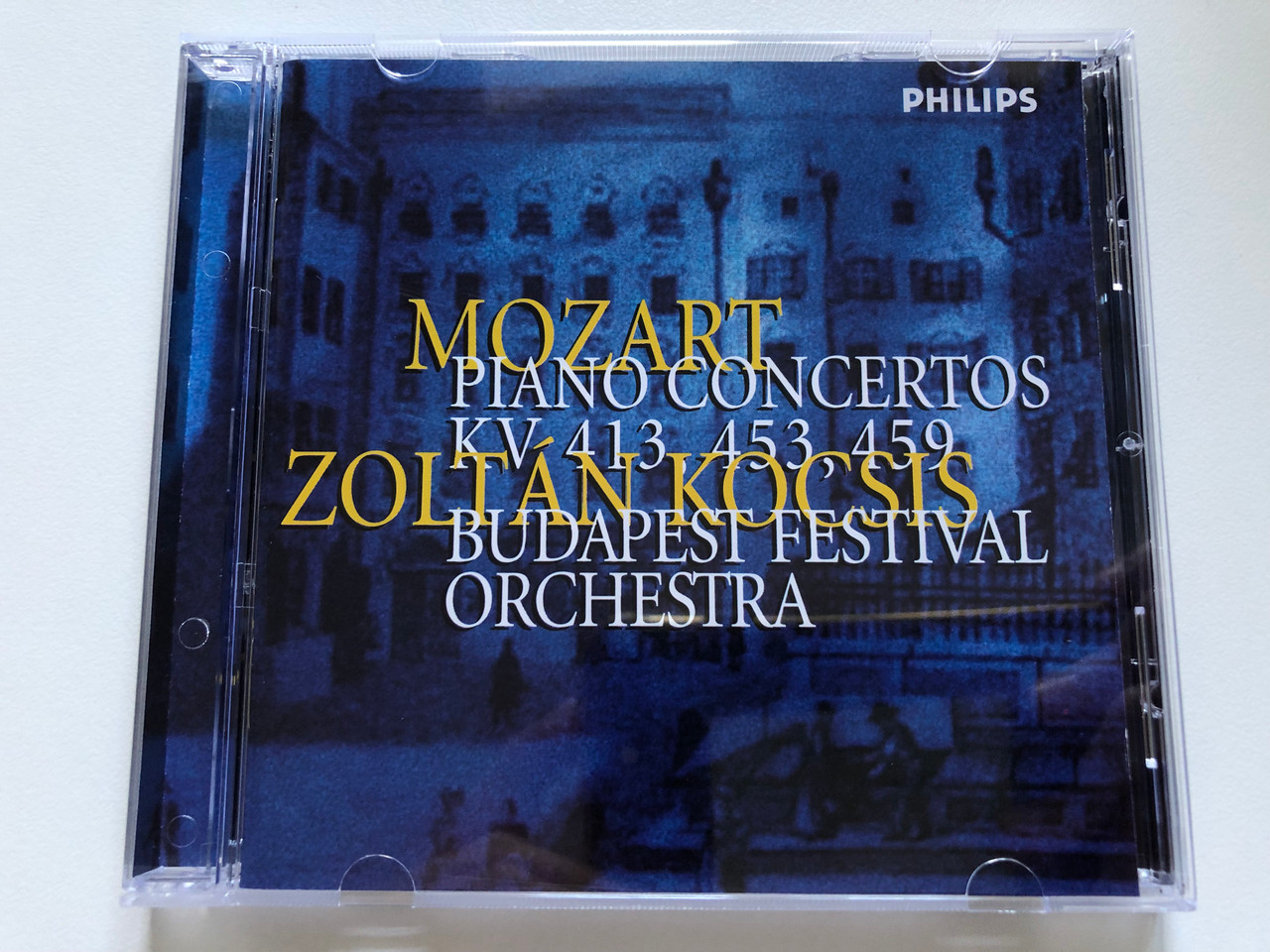 https://cdn10.bigcommerce.com/s-62bdpkt7pb/products/0/images/238669/Mozart_-_Piano_Concertos_KV_413_453_459_-_Zoltn_Kocsis_Budapest_Festival_Orchestra_Philips_Audio_CD_1998_456_577-2_1__27802.1657784160.1280.1280.JPG?c=2&_gl=1*1qrggnf*_ga*MjA2NTIxMjE2MC4xNTkwNTEyNTMy*_ga_WS2VZYPC6G*MTY1Nzc3OTYzMS40ODIuMS4xNjU3Nzg0MDg5LjYw
