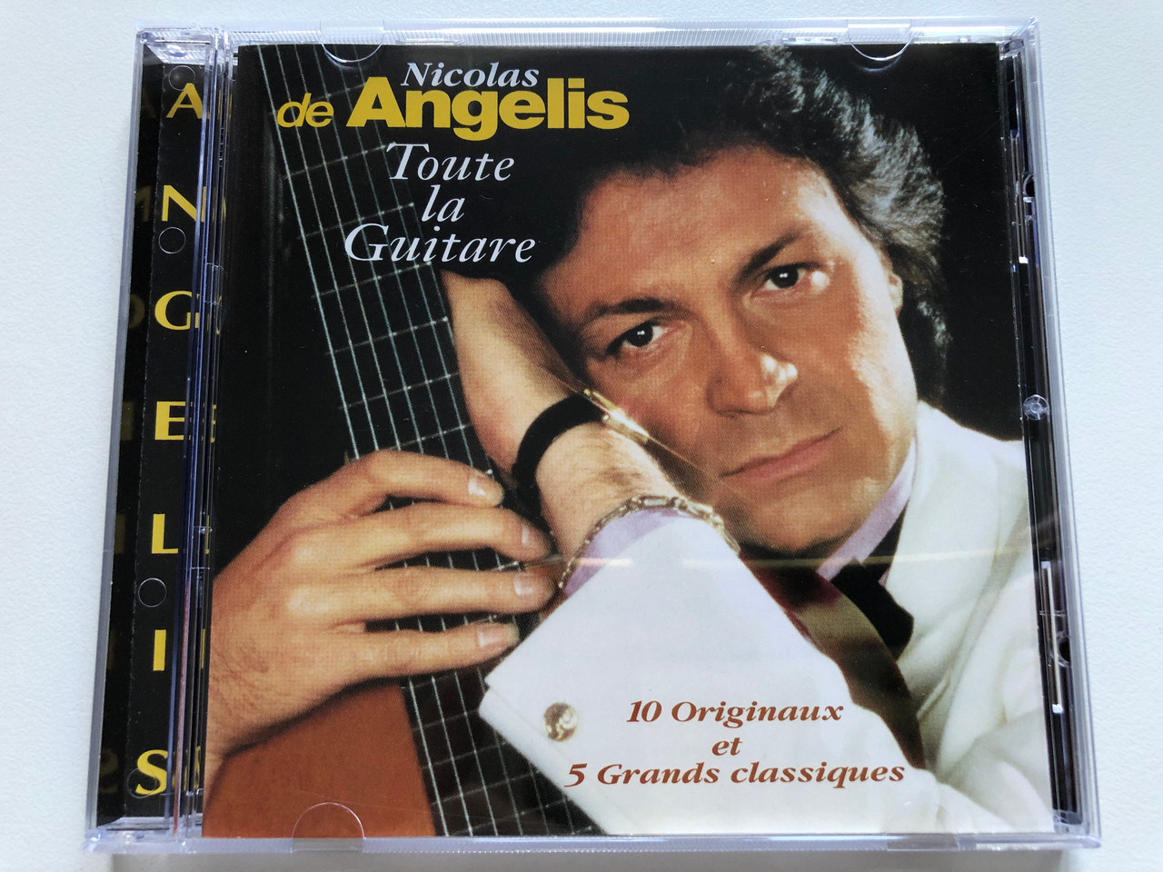 https://cdn10.bigcommerce.com/s-62bdpkt7pb/products/0/images/238928/Nicolas_De_Angelis_Toute_La_Guitare_10_Originaux_et_5_Grands_classiques_Delphine_Audio_CD_1994_DEL_27052_1__96716.1657865729.1280.1280.JPG?c=2&_gl=1*k1zpsy*_ga*MjA2NTIxMjE2MC4xNTkwNTEyNTMy*_ga_WS2VZYPC6G*MTY1Nzg1NzIzMC40ODQuMS4xNjU3ODY1NjM5LjM1