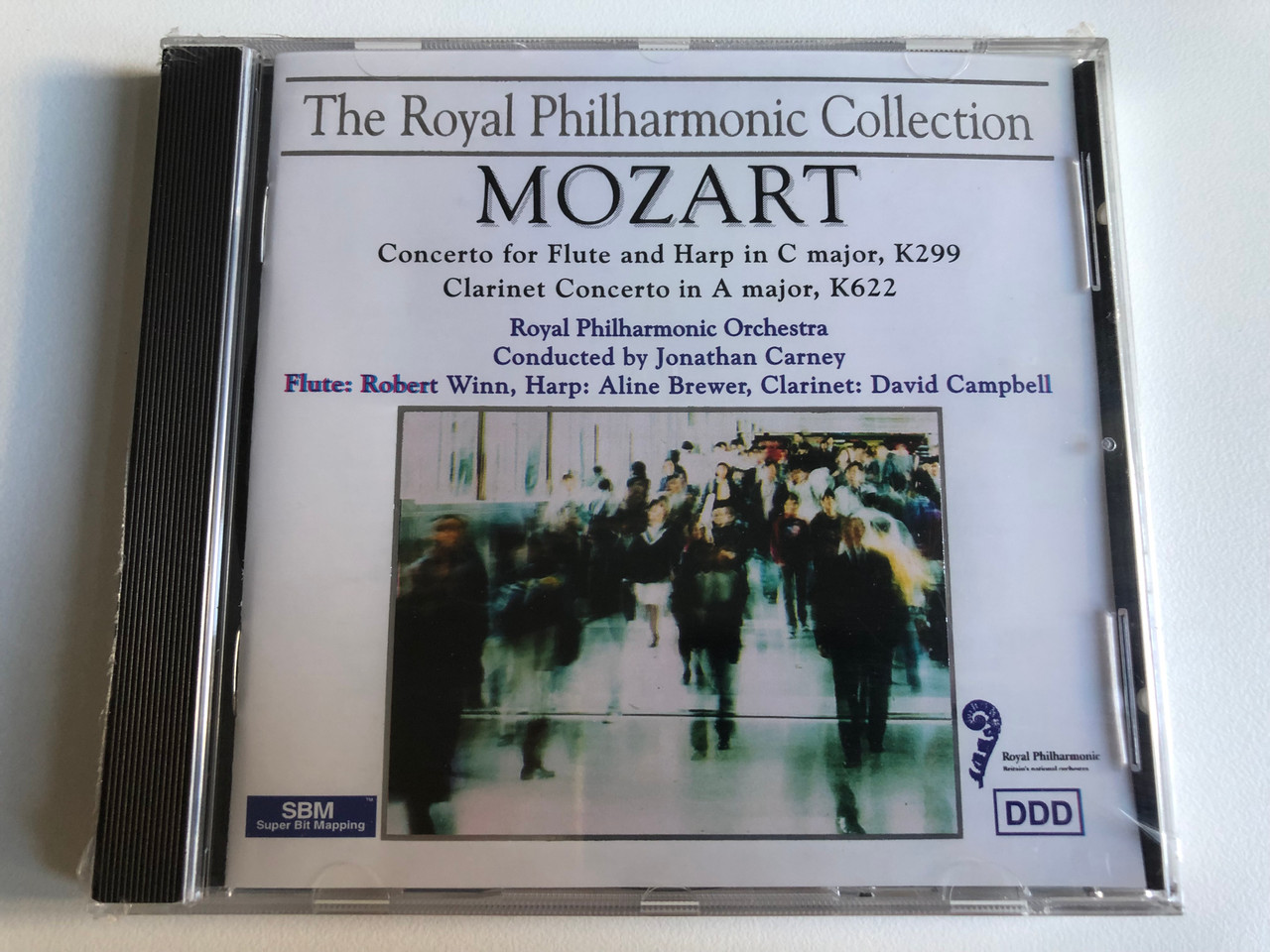 https://cdn10.bigcommerce.com/s-62bdpkt7pb/products/0/images/240201/The_Royal_Philharmonic_Collection_Mozart_-_Concerto_For_Flute_and_Harp_in_C_major_K299_Clarinet_Concerto_in_A_major_K622_Royal_Philharmonic_Orchestra_Conducted_by_Jonathan_Carney_Tring_1__16557.1658164865.1280.1280.JPG?c=2&_gl=1*nh2cbq*_ga*MjA2NTIxMjE2MC4xNTkwNTEyNTMy*_ga_WS2VZYPC6G*MTY1ODE1Mjc4Ni40ODUuMS4xNjU4MTY0NjE4LjQ5