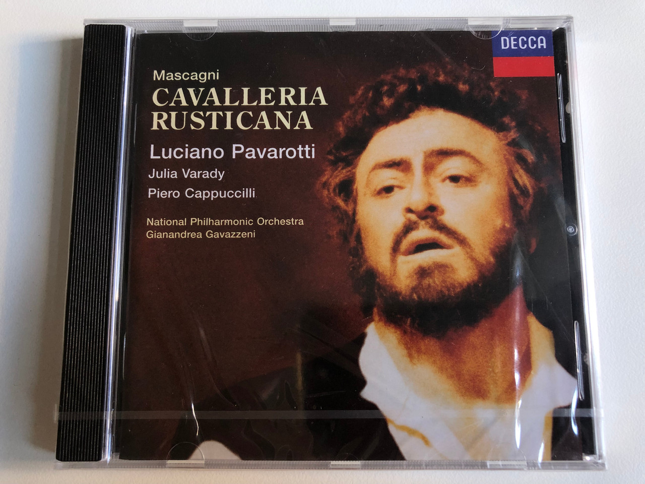 https://cdn10.bigcommerce.com/s-62bdpkt7pb/products/0/images/240208/Mascagni_-_Cavalleria_Rusticana_-_Luciano_Pavarotti_Julia_Vrady_Piero_Cappuccilli_National_Philharmonic_Orchestra_Gianandrea_Gavazzeni_Decca_Audio_CD_1996_444_391-2_1__92446.1658167666.1280.1280.JPG?c=2&_gl=1*1b4zj04*_ga*MjA2NTIxMjE2MC4xNTkwNTEyNTMy*_ga_WS2VZYPC6G*MTY1ODE1Mjc4Ni40ODUuMS4xNjU4MTY3MTM1LjE2